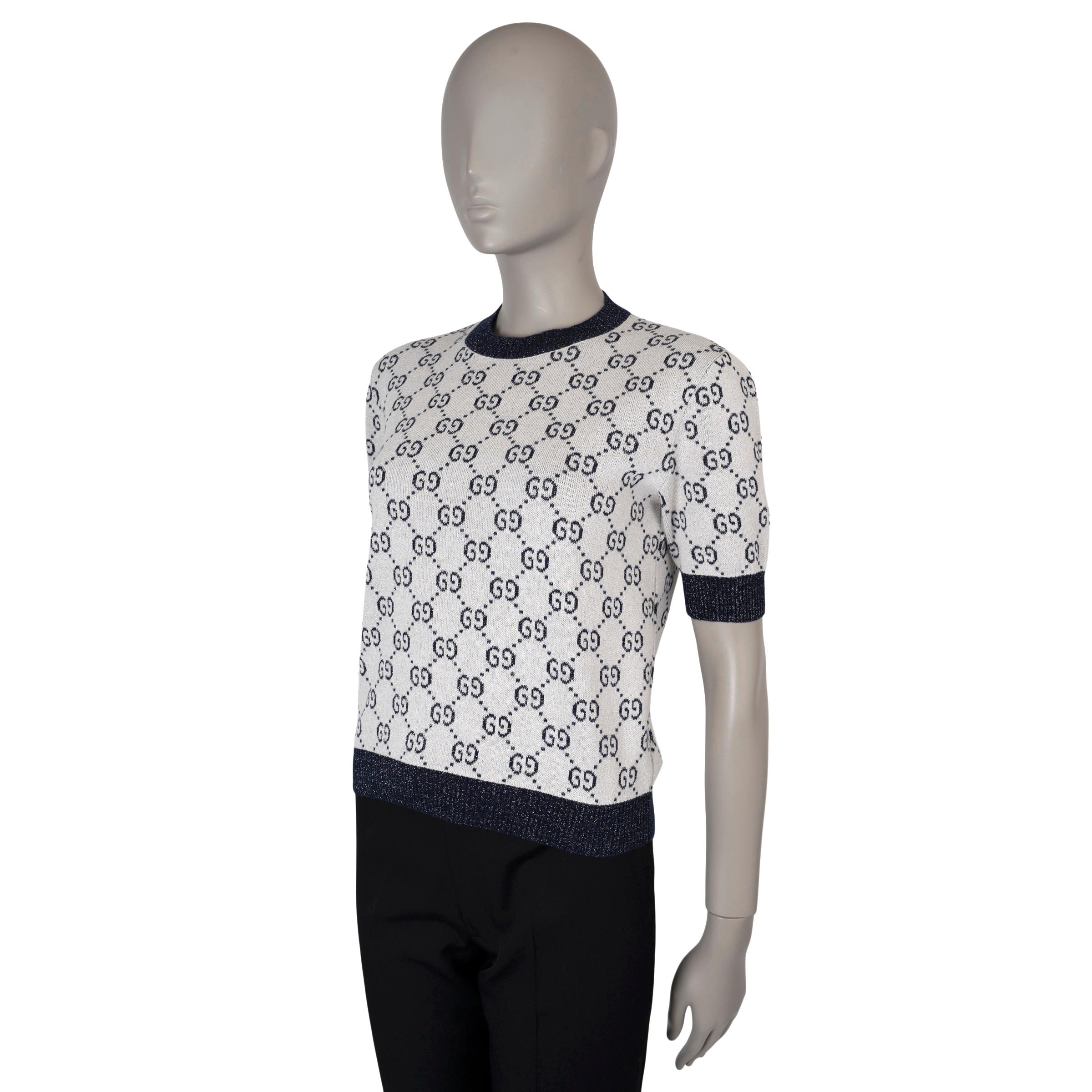 This 100% authentic Gucci GG Lamé knit top in cream, navy blue, and silver is crafted from a luxurious blend of cotton (86%), metallic fiber (9%), and polyamide (5%). It showcases an allover GG monogram pattern, with a classic crewneck, short