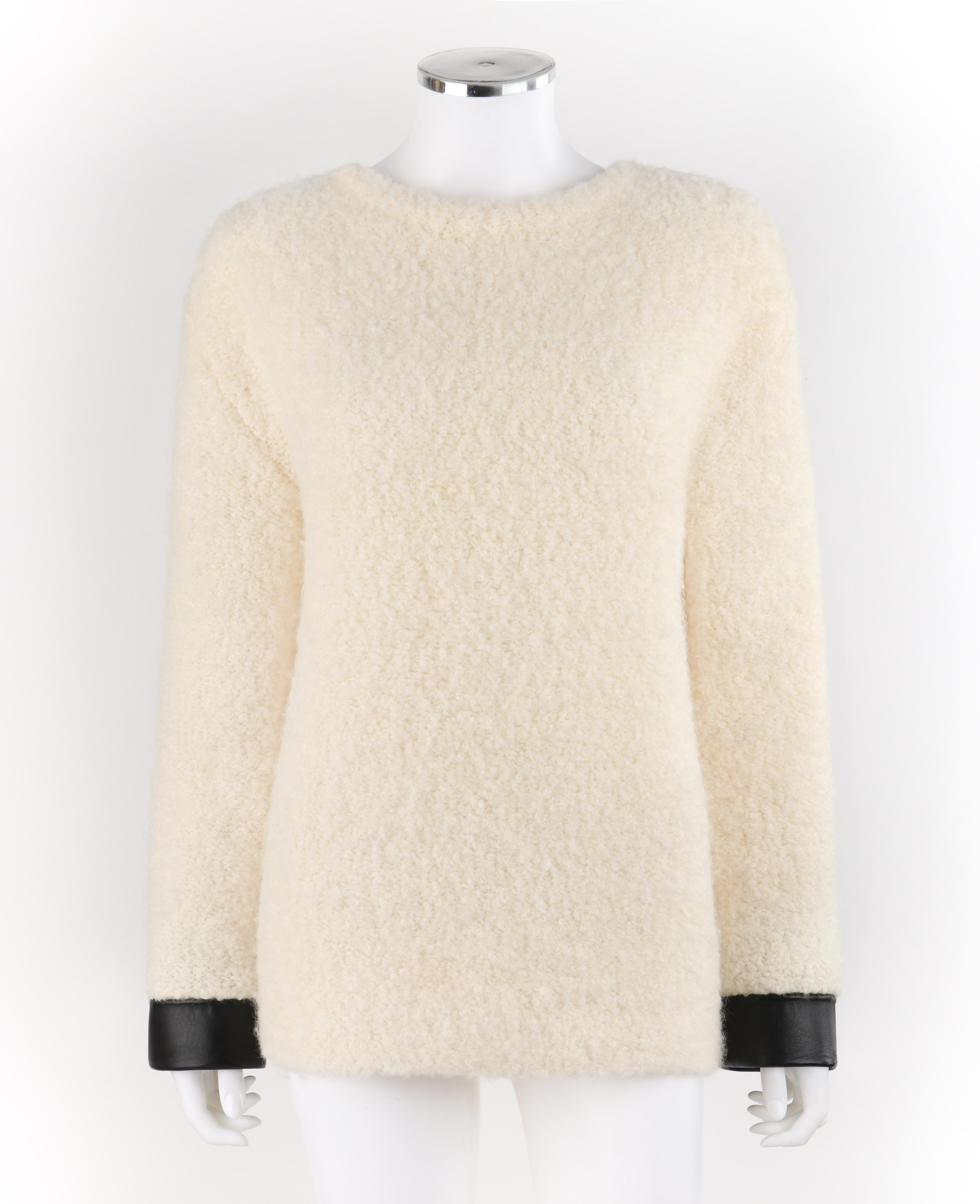 GUCCI Cream Boucle Alpaca Wool Knit Leather Cuffs Oversize Pullover Sweater
 
Estimated Retail: $1,630
 
Brand / Manufacturer: Gucci 
Style: Sweater
Color(s): Cream & Black 
Lined: No      
Marked Fabric Content: 61% Wool, 35% Alpaca, 4% Nylon