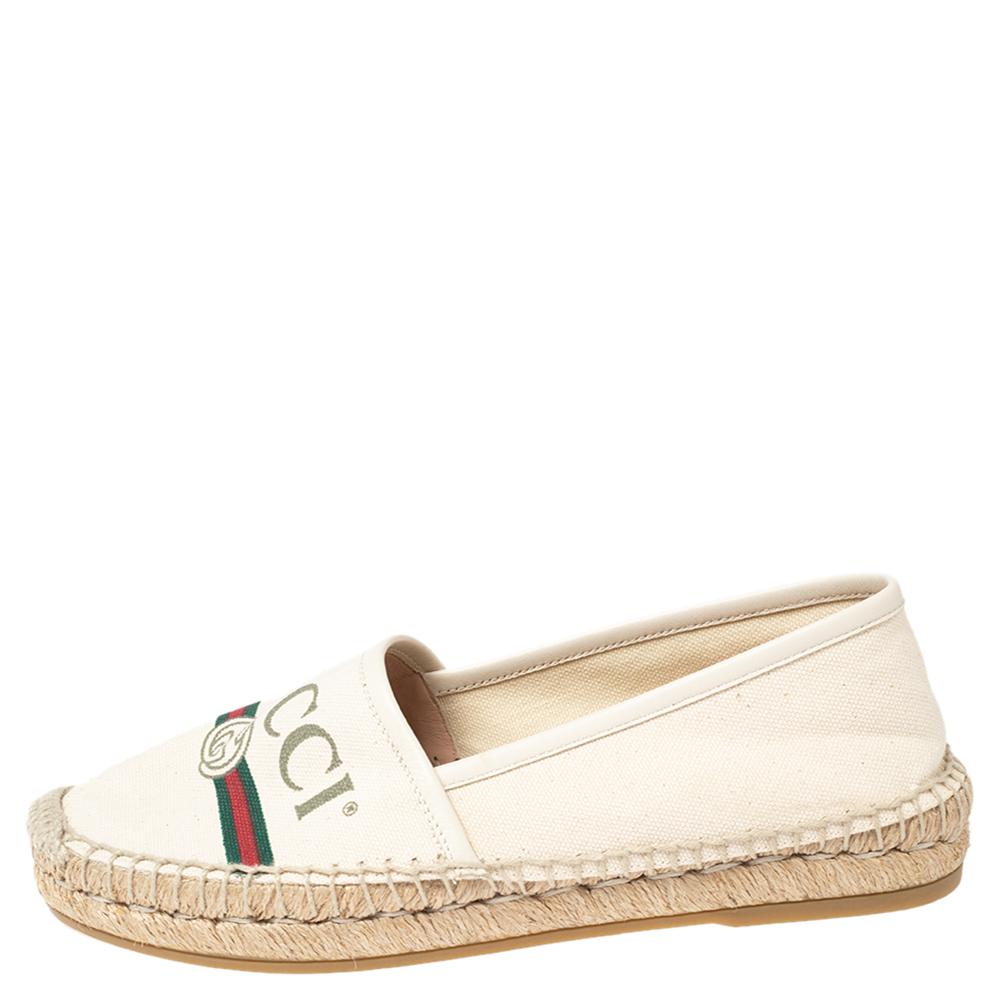 Step out in style and make others go gaga over these chic espadrilles from Gucci! These cream espadrilles are crafted from canvas and feature round toes. They have been detailed with a vintage brand logo and the signature web print on the vamps.