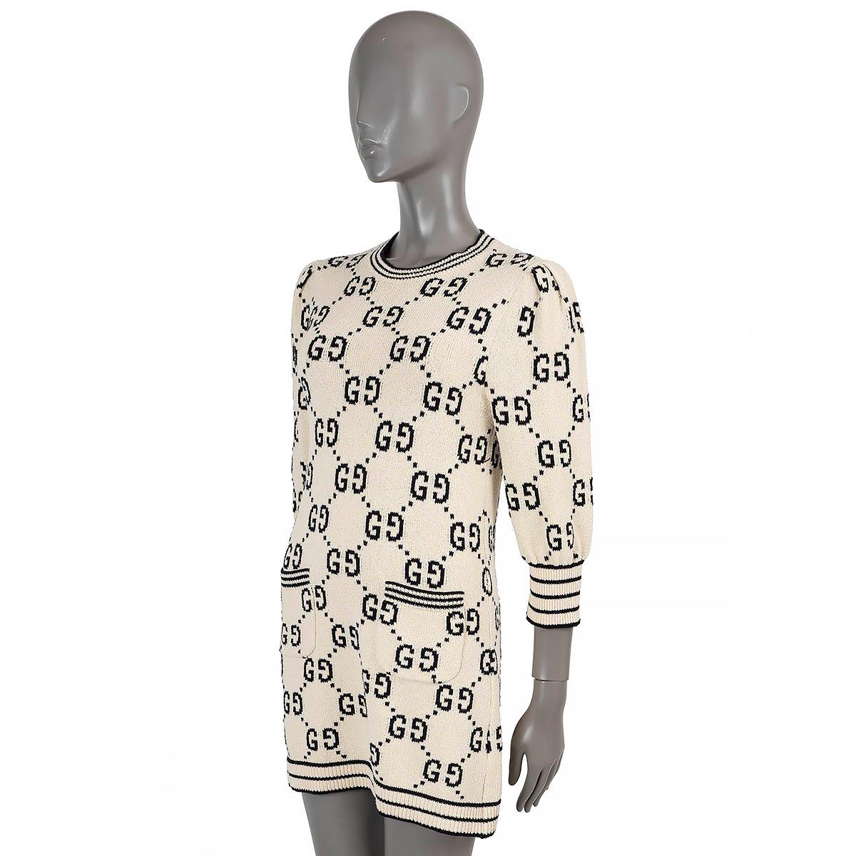 100% authentic Gucci GG Monogram knit dress in cream and black jacquard cotton (with 28% polyamide - please note the content tag is missing). Features a crewneck, two pockets at the waist and short puff-sleeves  with rib-knit cuffs. Has been worn