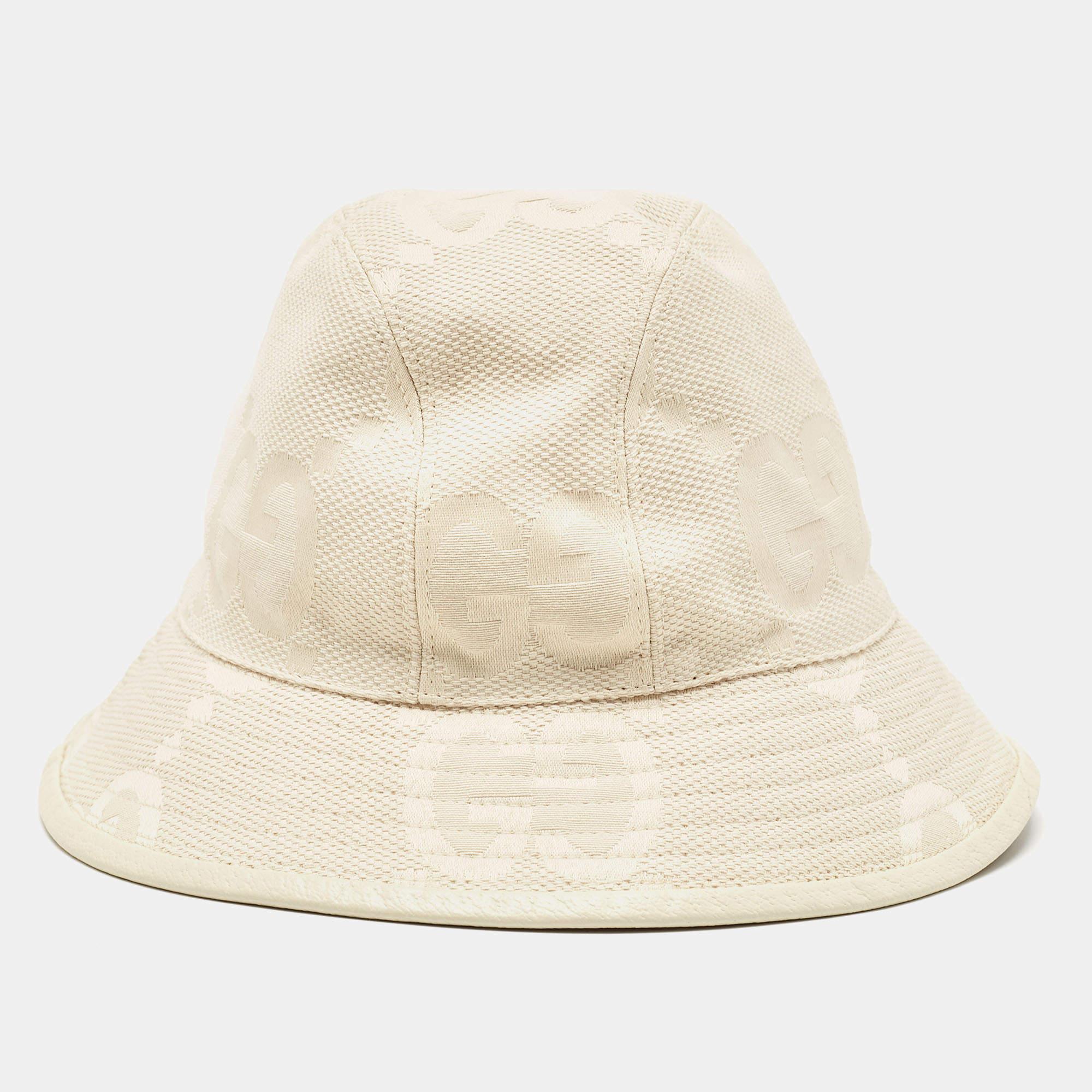 Embrace the chic allure of the Gucci hat. Crafted from luxurious cream GG canvas, this hat exudes effortless style. Its narrow brim adds a contemporary touch while the iconic GG pattern showcases timeless elegance. Perfect for adding a dash of