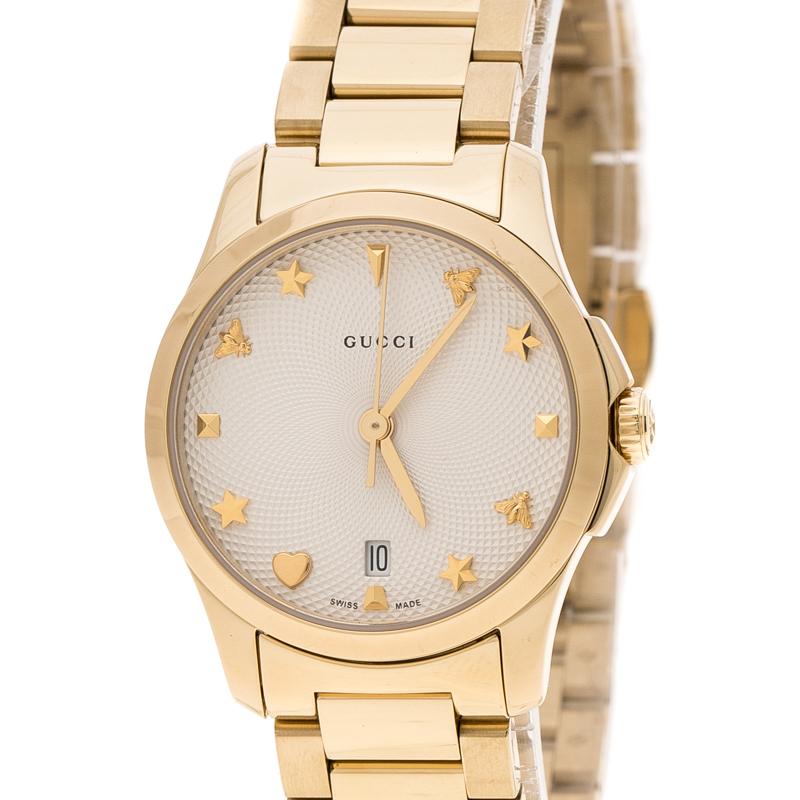 A perfect piece of accessory to pair with both your daytime casuals as well as smarter and chic looks, this Gucci G-Timeless wristwatch is a must have for women with classic taste. This watch features a cream textured dial with alternate bee, star,