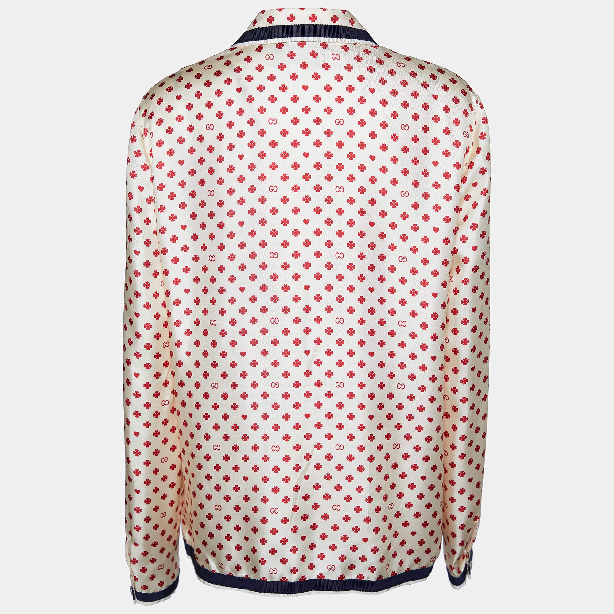 The Gucci shirt is a stylish and luxurious wardrobe addition. Made from premium silk, it features charming hearts and clover print, while the button front adds a classic touch. Perfect for adding a touch of sophistication to any ensemble.

