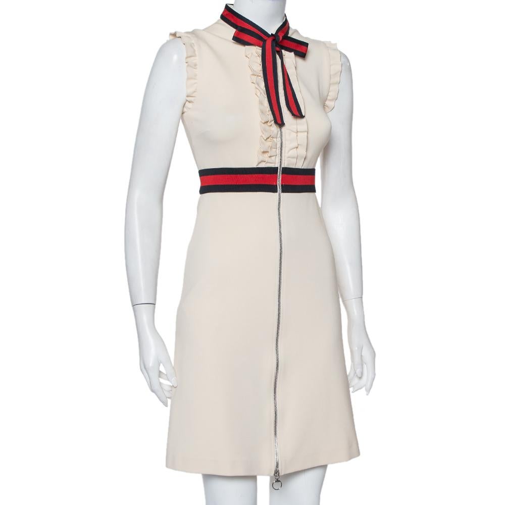 Show your love for contemporary fashion by donning this dress from Gucci. It comes made from quality fabrics and enhanced with ruffled details and a flattering silhouette. The front long zip closure and the signature Web stripe trims add to its