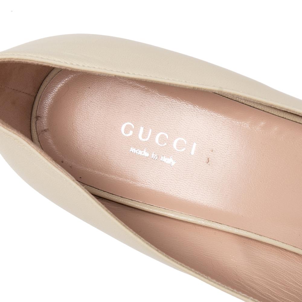 Gucci's timeless aesthetic and stellar craftsmanship in shoemaking is evident in these stunning slide pumps. Crafted from leather, the silhouette is adorned with an embellished G motif on the uppers then raised on low block heels. Style them with