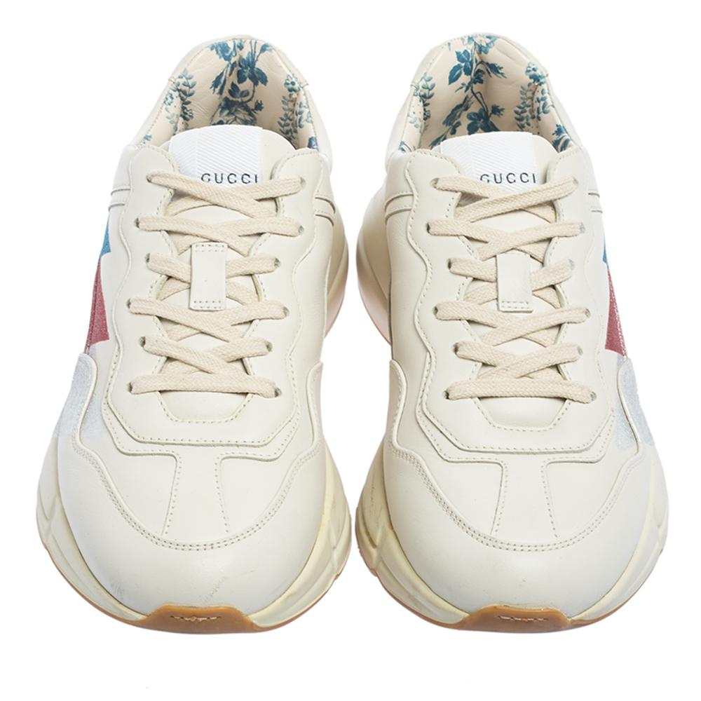 Designed into a chunky size, these Rhyton Gucci sneakers are not just stylish in appeal but also comfortable to wear. Crafted from leather, they are designed with Web accents atop a cream background on the sides. Finished off with laces on the