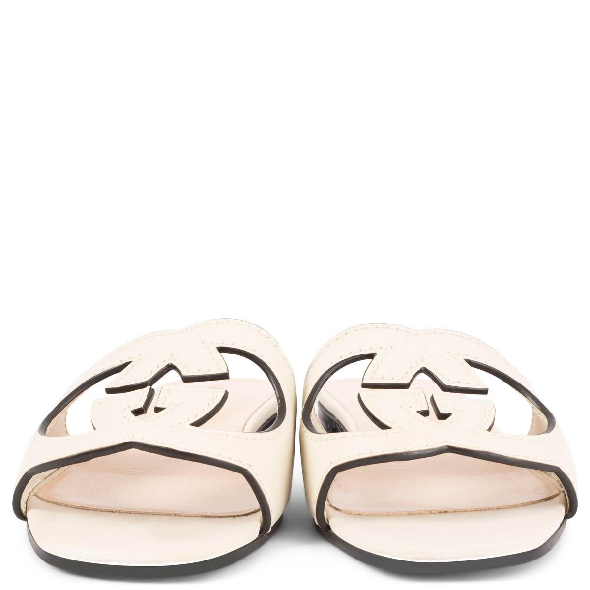 100% authentic Gucci interlocking G cut-out slide sandals in ivory leather. Have been worn and are in excellent condition. 

Measurements
Imprinted Size	35
Shoe Size	35
Inside Sole	22.5cm (8.8in)
Width	7cm (2.7in)
Heel	1.5cm (0.6in)

All our
