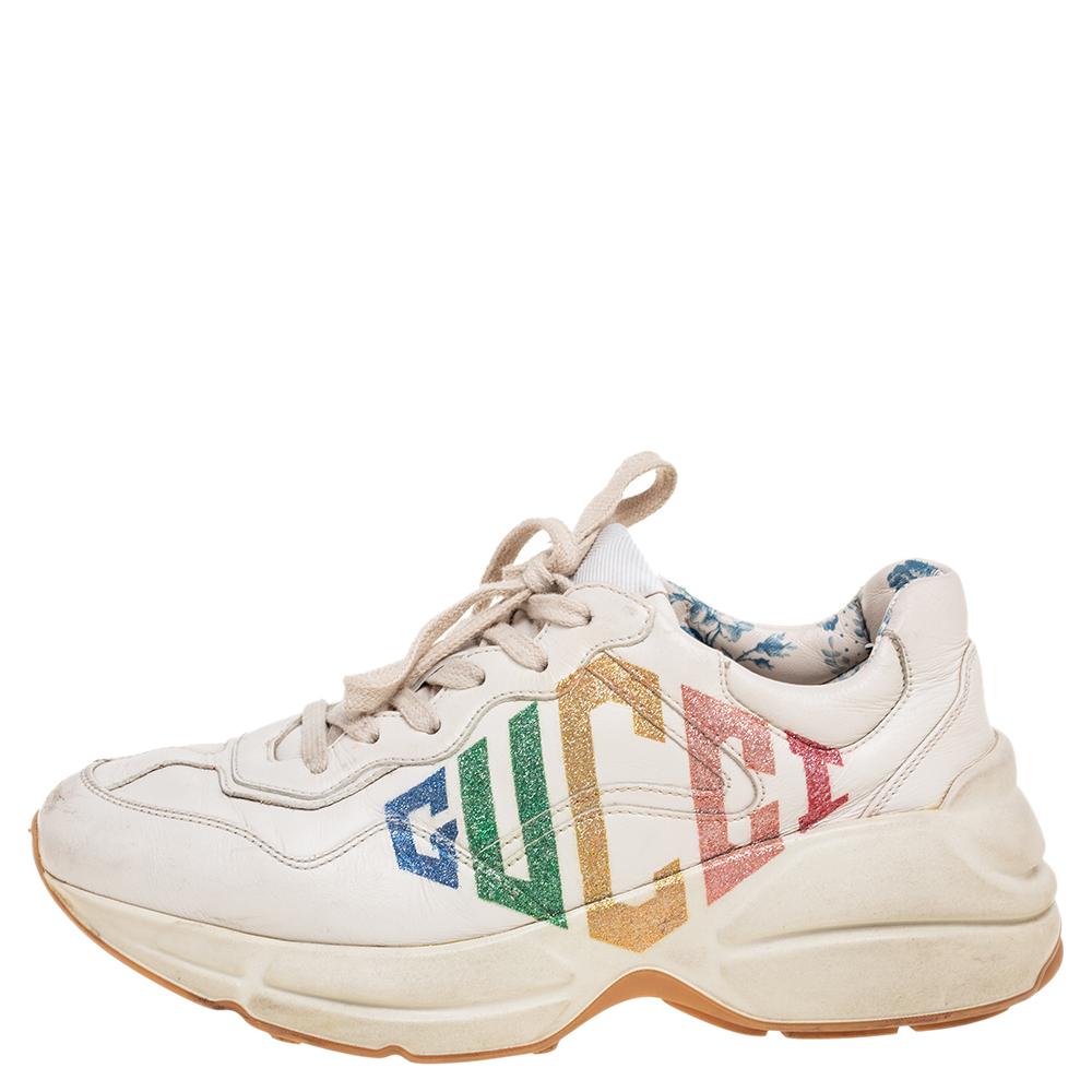 Designed into a chunky size, these Rhyton Gucci sneakers are not just stylish in appeal but also comfortable to wear. Crafted from leather, they are designed with a logo atop a cream background on the sides. Finished off with laces on the vamps,
