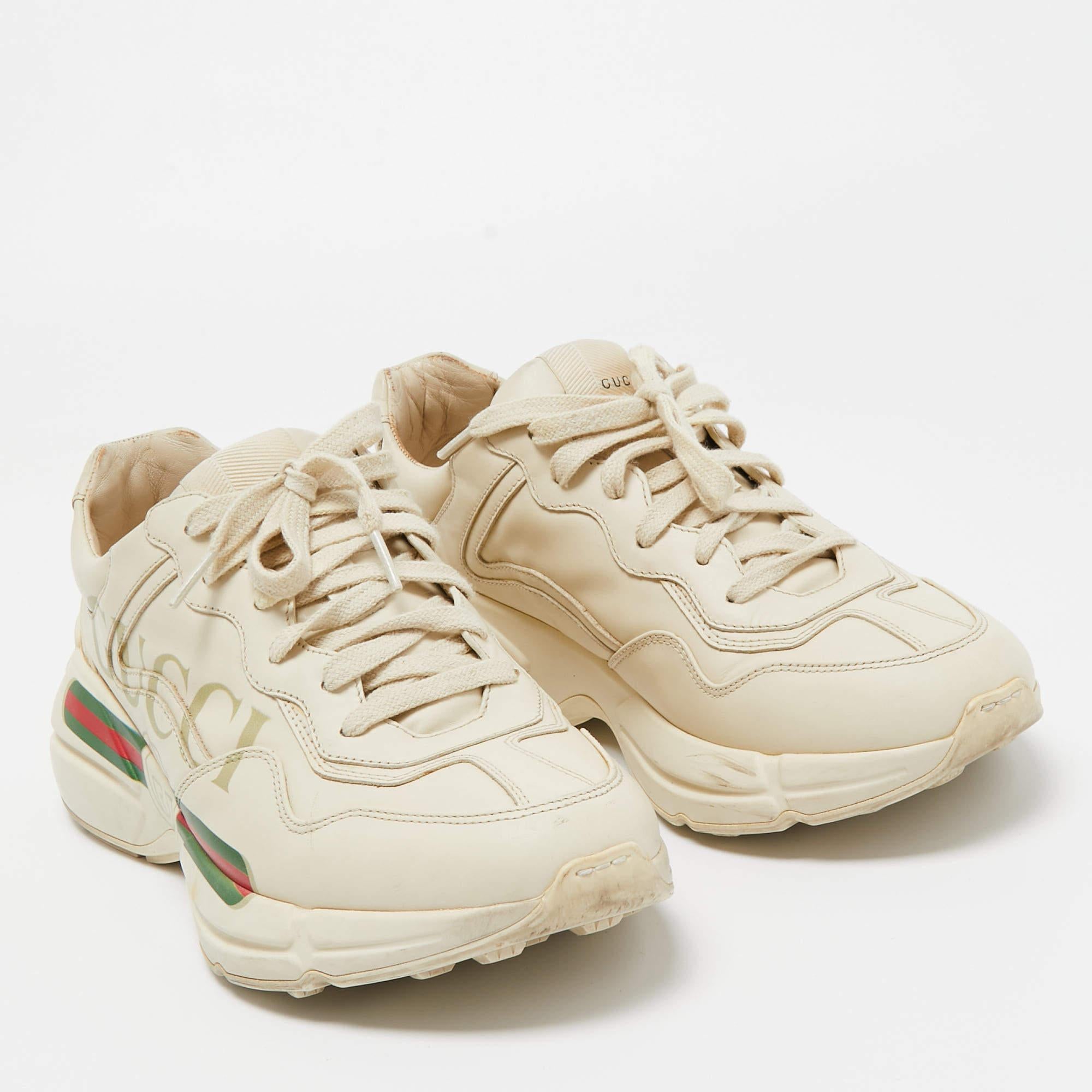 The time to feel trendy is now as Gucci brings you these superhit sneakers in cream. They are crafted from leather, detailed with lace-ups, and Web print on the sides and are set on highly comfortable soles. You are sure to receive nods of approval