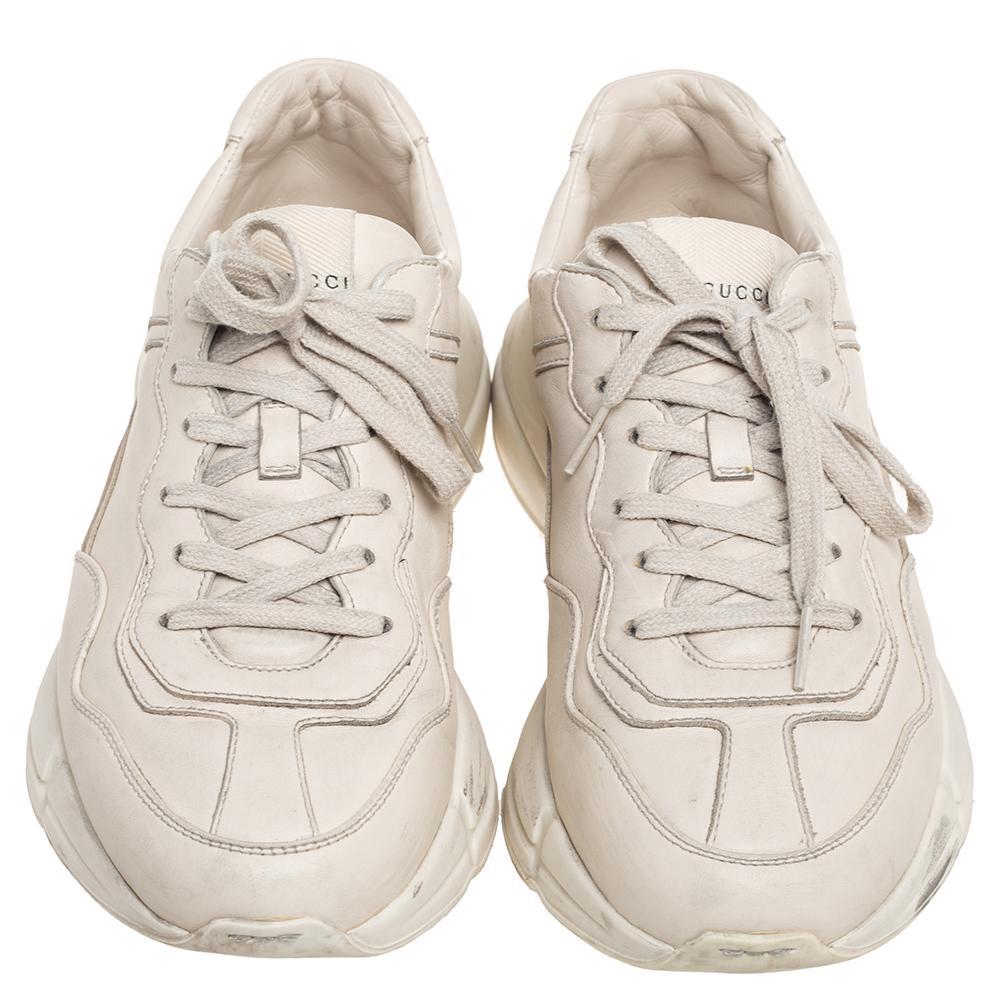 The time to feel trendy is now as Gucci brings you these superhit Rhyton sneakers. They are crafted from quality leather, detailed with lace-ups, and are set on highly comfortable platforms. You are sure to receive nods of approval when you step out
