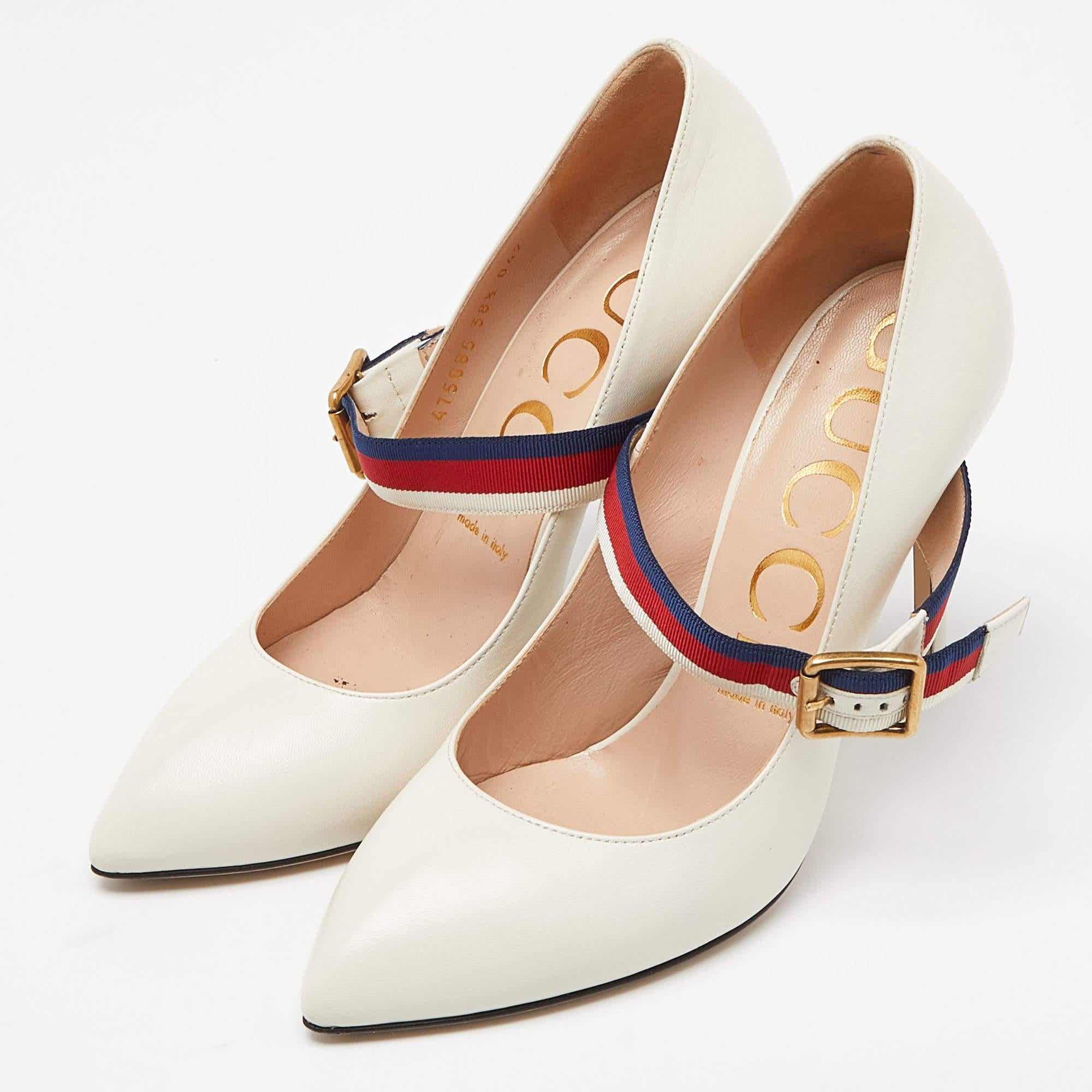 These Gucci Mary Jane Sylvie pumps exude a timeless appeal. Crafted from leather in Italy, they feature a signature strap with buckle fastening, pointed toes, and 11 cm stiletto heels. The white color adds to the appeal of the fashionable