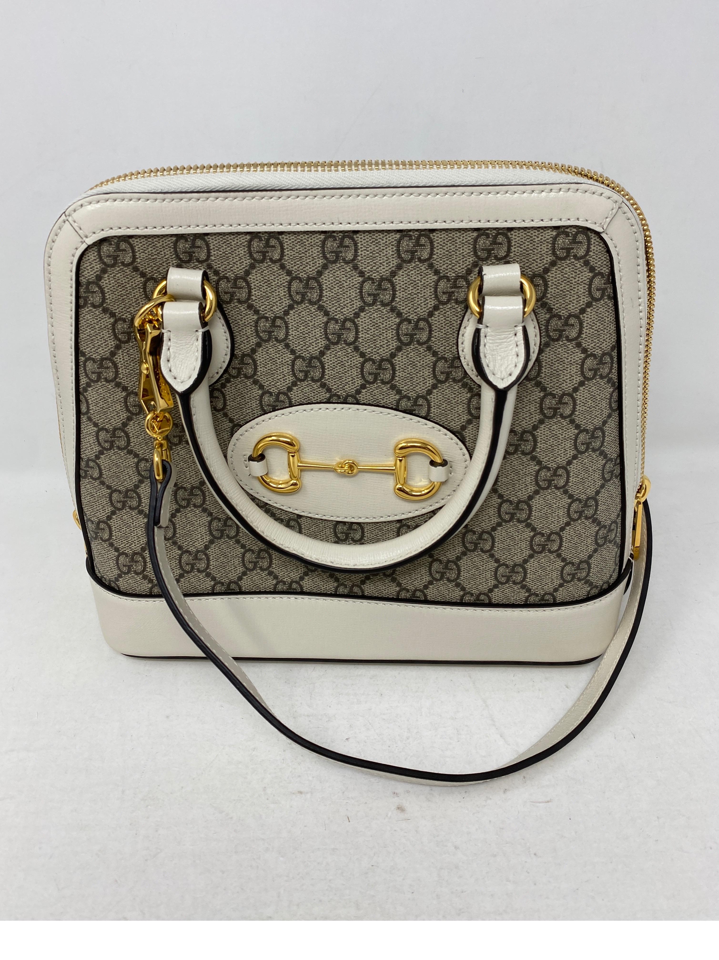 Gucci Cream Monogram Horsebit Bag. Leather and Gucci canvas. Gold hardware. Excellent like new condition. Guaranteed authentic. 