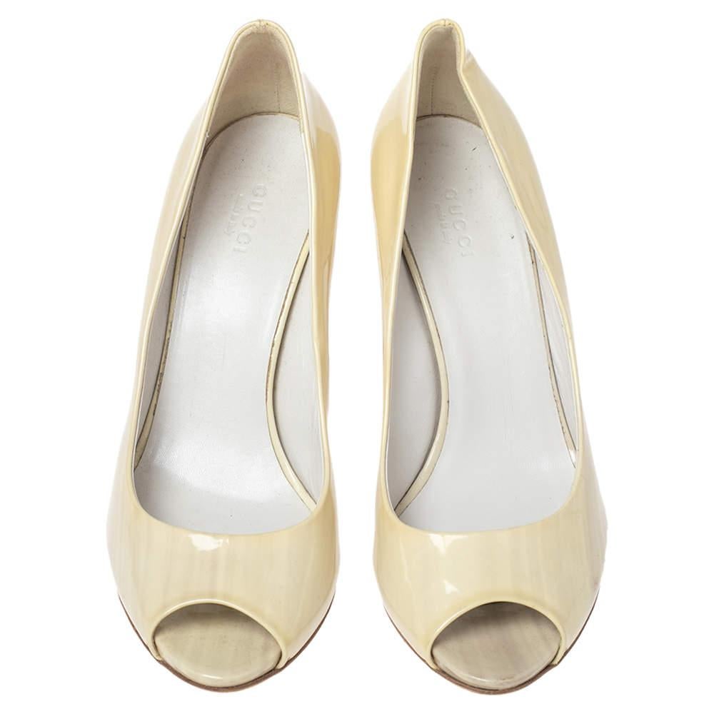 There are some shoes that stand the test of time and fashion cycles, these timeless Gucci pumps are the one. Crafted from patent leather in a cream shade, they are designed with sleek cuts, peep-toes, and sturdy heels.

Includes: Original Dustbag

