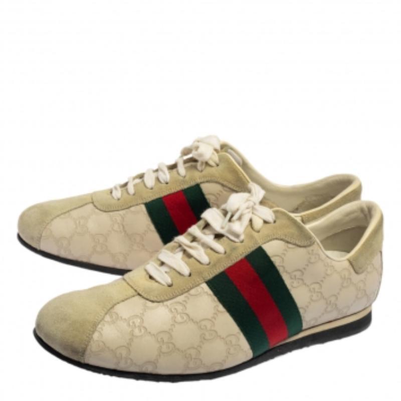 Ace that cool, casual look with these sneakers from Gucci. Stacked with signature details, this pair is rendered in GG leather and suede and is designed in low-cut style with lace-up vamps. They have been fashioned with iconic web stripes on the