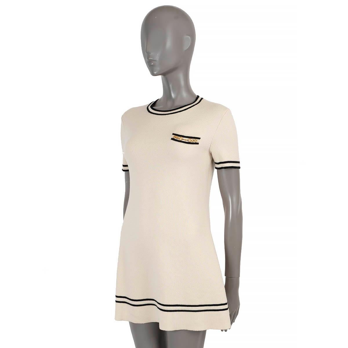 100% authentic Gucci knit dress in white wool (100% - please note the content tag is missing) with contrasting black strip trims. Features a relaxed silhouette, crewneck, short sleeves and chest pocket with horsebit chain detail in gold-tone.