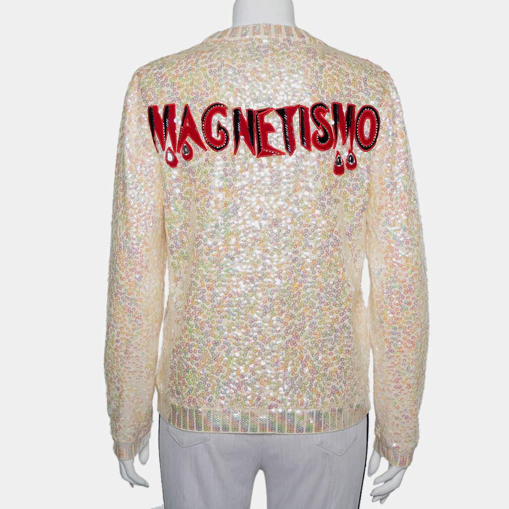 Beautifully made from wool, this dreamy Gucci sweater is designed with a crew neck, long sleeves, and dazzling sequin embellishments forming Snow White's image on the front. The cream creation will surely add a fashionable touch to your wardrobe.

