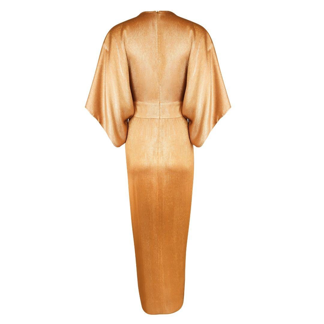 Gold lamé Gucci kimono sleeve wrap effect full length dress, as featured in the ad campaign for the 2014 Cruise collection worn by Andreea Diaconu. As seen on Jennifer Lopez at the Golden Globes after party, Lady Gaga on the cover of Glamour, and