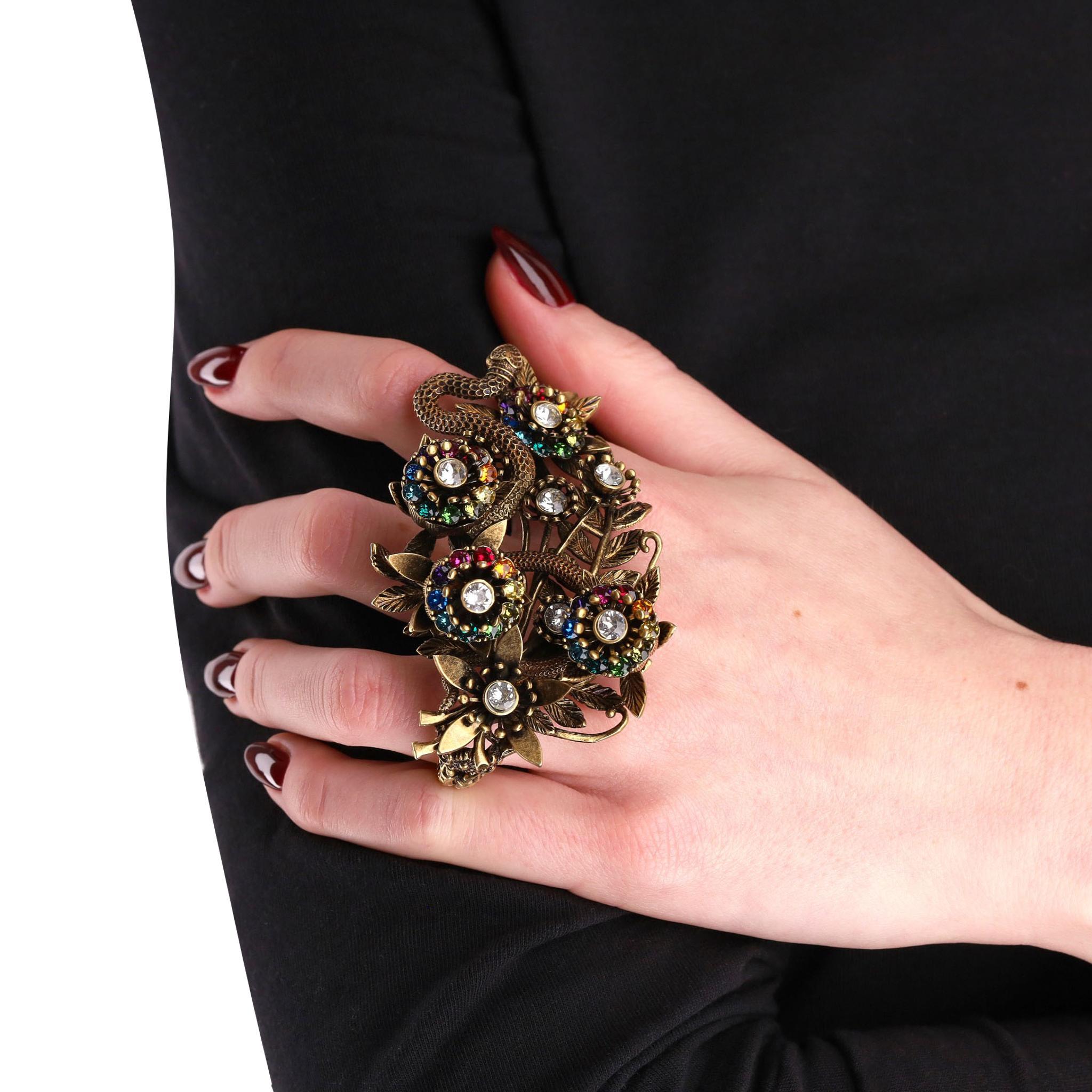 Gucci Crystal Garden Double Finger  Ring 

Large statement ring with Snake and floral detailing set with multi-coloured crystals.

Size - 49-62

Condition - Excellent

Composition - Metal, Crystal 

Comes With - Original Box, Dust Bag