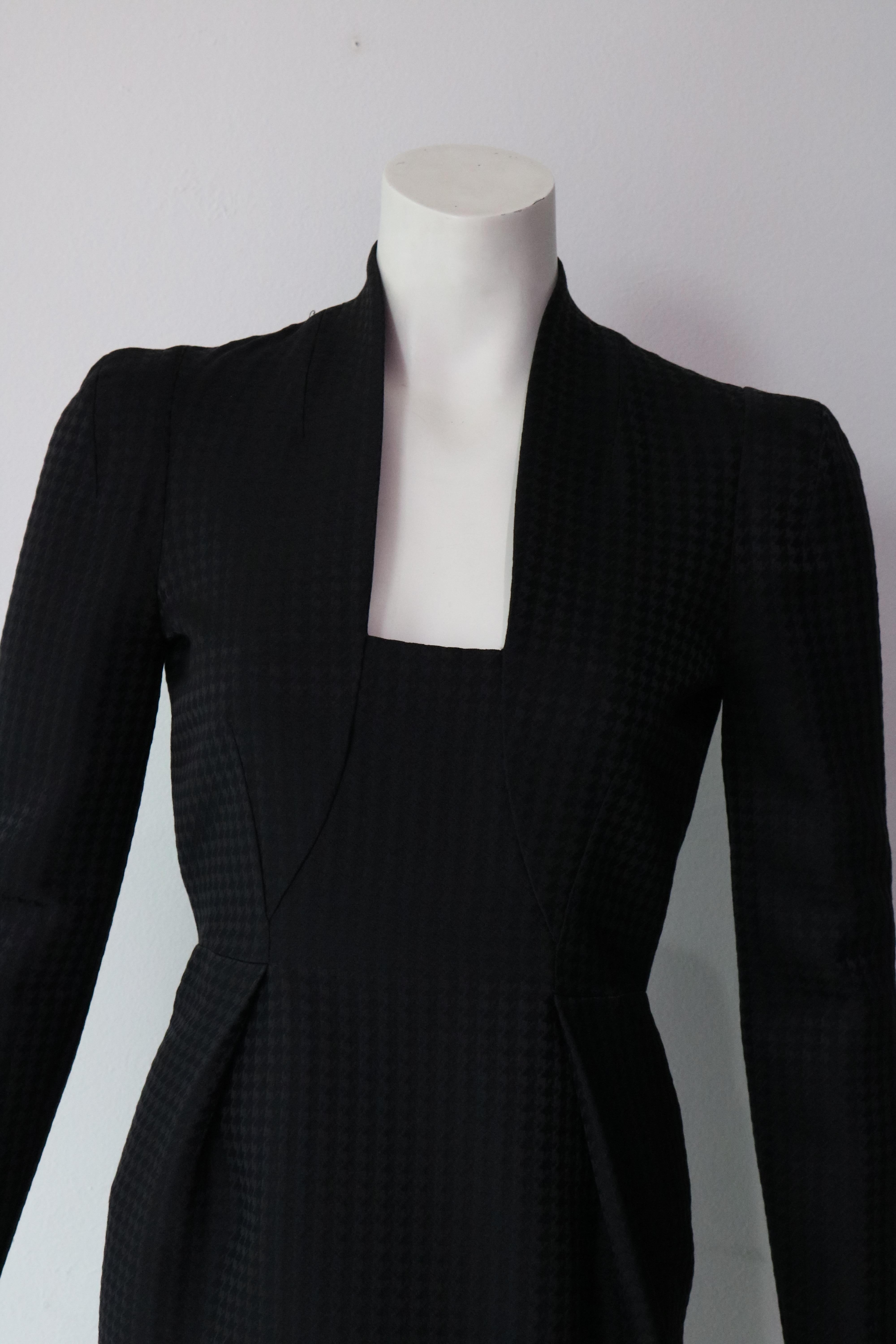 Chic and elegant black dress
86% wool 
14% silk 
Size 40 (fits smaller) 
Made in Italy 
Retail Price $2,500
Mint Condition 
