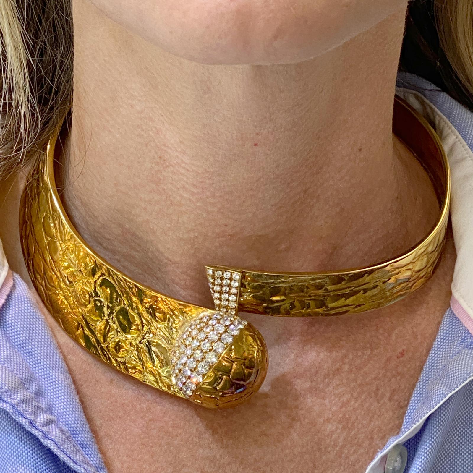 Custom designer diamond necklace by Gucci. This one of a kind necklace is fashioned in textured 18 karat yellow gold. The bypass collar necklace features 87 round brilliant cut diamonds weigh approximately 6.33 carat total weight and are graded F-G