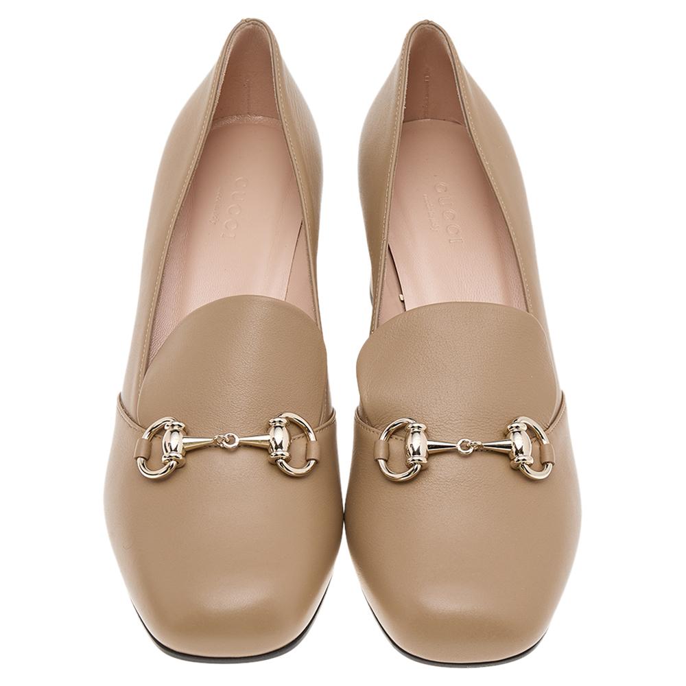 Elevate your style with these loafer pumps from Gucci. Made with a leather exterior, decorated with the Horsebit, and lifted on 5 cm heels, these slip-on pumps are a fine example of luxurious comfort.

Includes: Original Dustbag, Original Box, Info