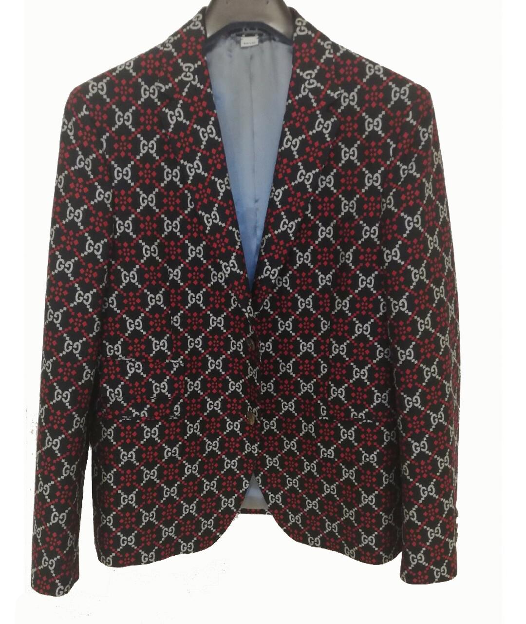 GUCCI 


Plain weave, no appliqués, logo design, multipockets, single chest pocket, button closing, lapel collar, single-breasted , long sleeves, fully lined, contains non-textile parts of animal origin

Content:
68% Cotton, 32% Wool


Country of