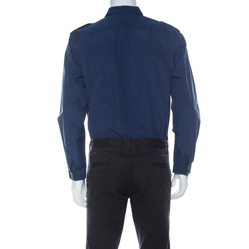 This shirt from Gucci is comfortable to wear. The shirt comes in dark blue and it features a straight collar, front button fastenings, and cuffed sleeves. A pair of trousers and loafers will complete the look perfectly.

Includes: The Luxury Closet