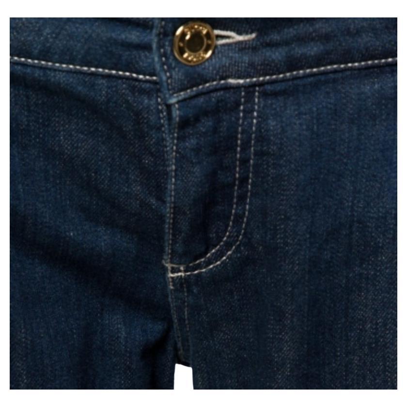 These jeans from Gucci are designed to exude a chic vibe. The dark blue denim jeans exhibit a tapered silhouette and come equipped with a front button and zip closure and four pockets. They will look great with simple tops and ballet flats.