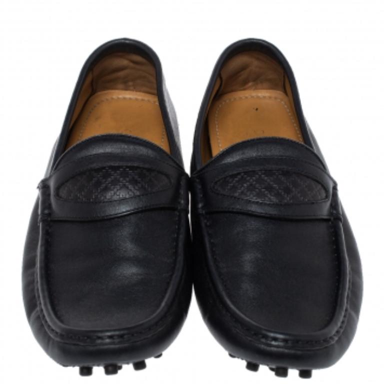 There is nothing more comfortable and stylish than a pair of loafers like these Gucci ones. Fashioned in a neat silhouette, this pair has a dark blue leather body and comes with the signature Diamante pattern detailed panel at the vamps. It is