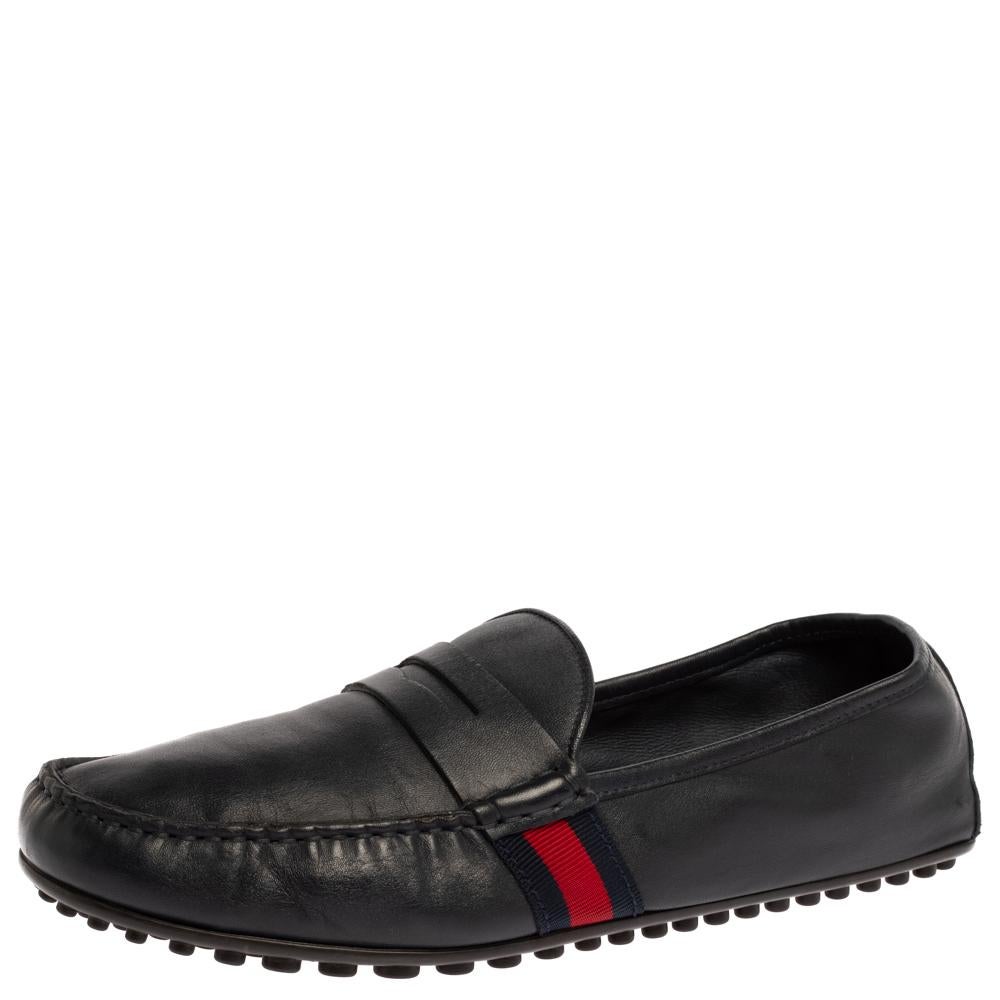 Made from dark blue leather, these loafers from Gucci are smart and comfortable. They feature penny keeper straps on the vamps, Web accents on the sides, snug, labeled insoles, and rubber pebbling on the outsoles. Flaunt them with both your casual