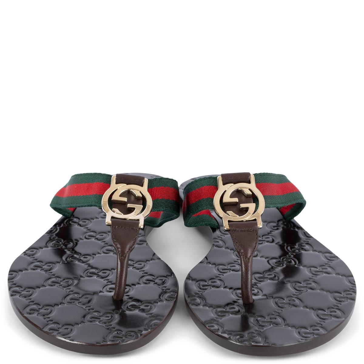 100% authentic Gucci GG thong web sandals in espresso brown monogram leather with signature web-stripe in green and red. Embellished with light gold-tone GG buckle. Have been worn once inside and are in virtually new
