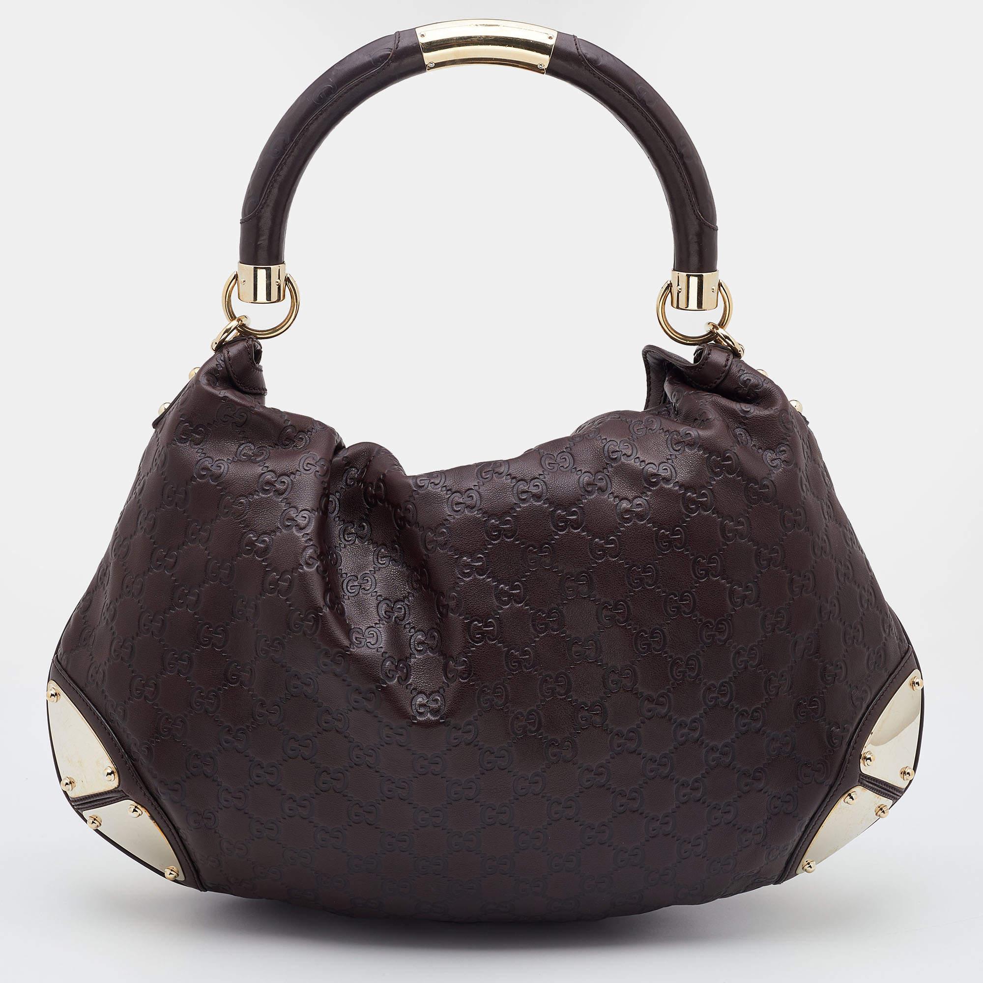 Crafted from Guccissima leather, this Gucci hobo has a top with two bamboo-detailed tassels and a spacious fabric interior. It also features a sturdy top handle, armored corners, and gold-tone hardware.

Includes: Original Dustbag, Detachable Strap