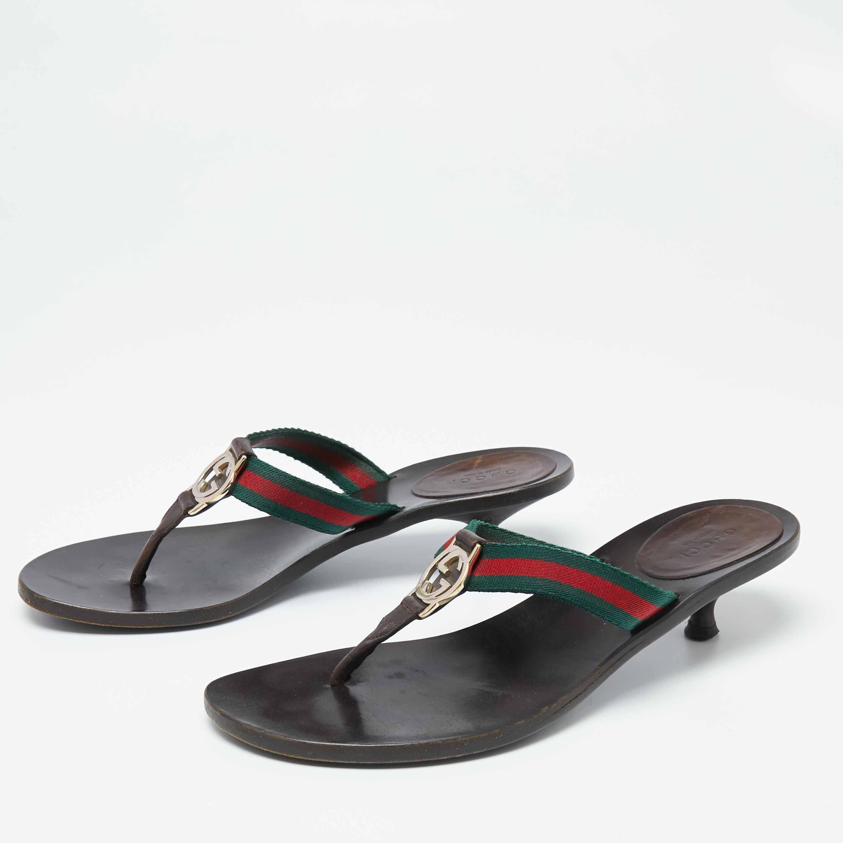 Slip on these Gucci GG Thong sandals for a casual day out. They have Web straps and the GG logo for the classic Gucci look. The sandals are set on kitten heels.

Includes: Original Dustbag