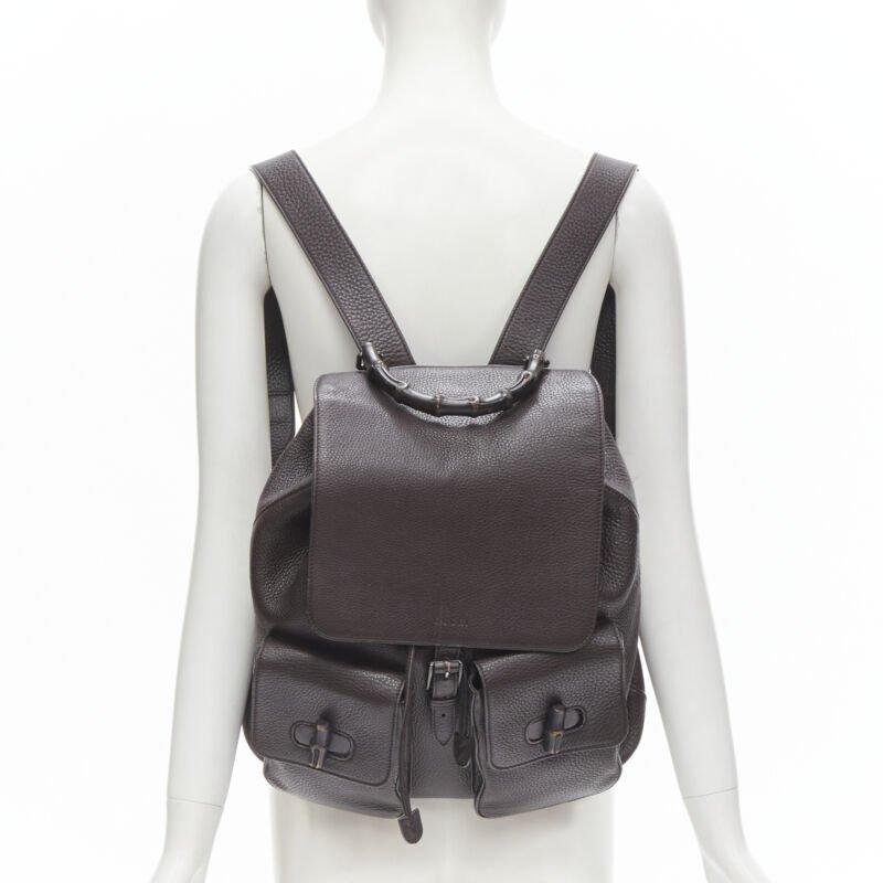 GUCCI dark brown pebble leather Bamboo turnlock pocket flap backpack bag
Reference: JACG/A00006
Brand: Gucci
Model: 387097 001998
Collection: Bamboo
Material: Leather
Color: Brown
Pattern: Solid
Closure: Turnlock
Lining:  Fabric
Extra Details: Dark