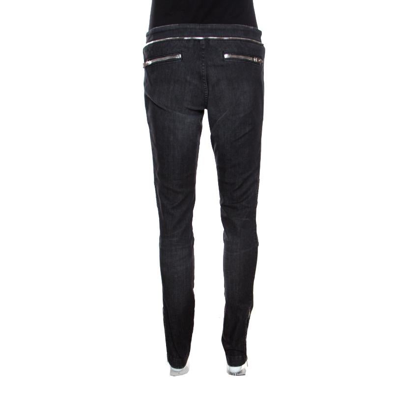 Wear these amazing jeans from Gucci on days when you wish to hit a high-fashion note. They are made of a cotton blend and offer a skinny fit and cool zipper detailing. You must try wearing it with a tank top, a leather jacket and block heel ankle