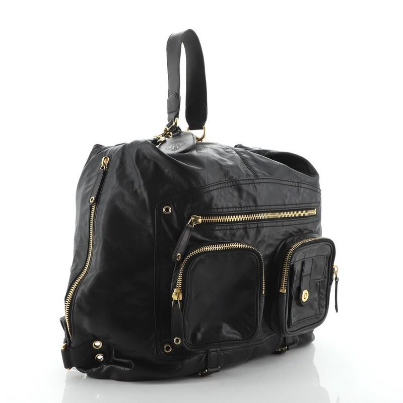Condition: Very good. Minor wear, scuffs and creasing on exterior, oil slick discoloration, scuffs and wear on straps, handle and zipper pulls. Moderate splitting and cracking on handle and strap wax edges, scratches on hardware. 
Accessories:
