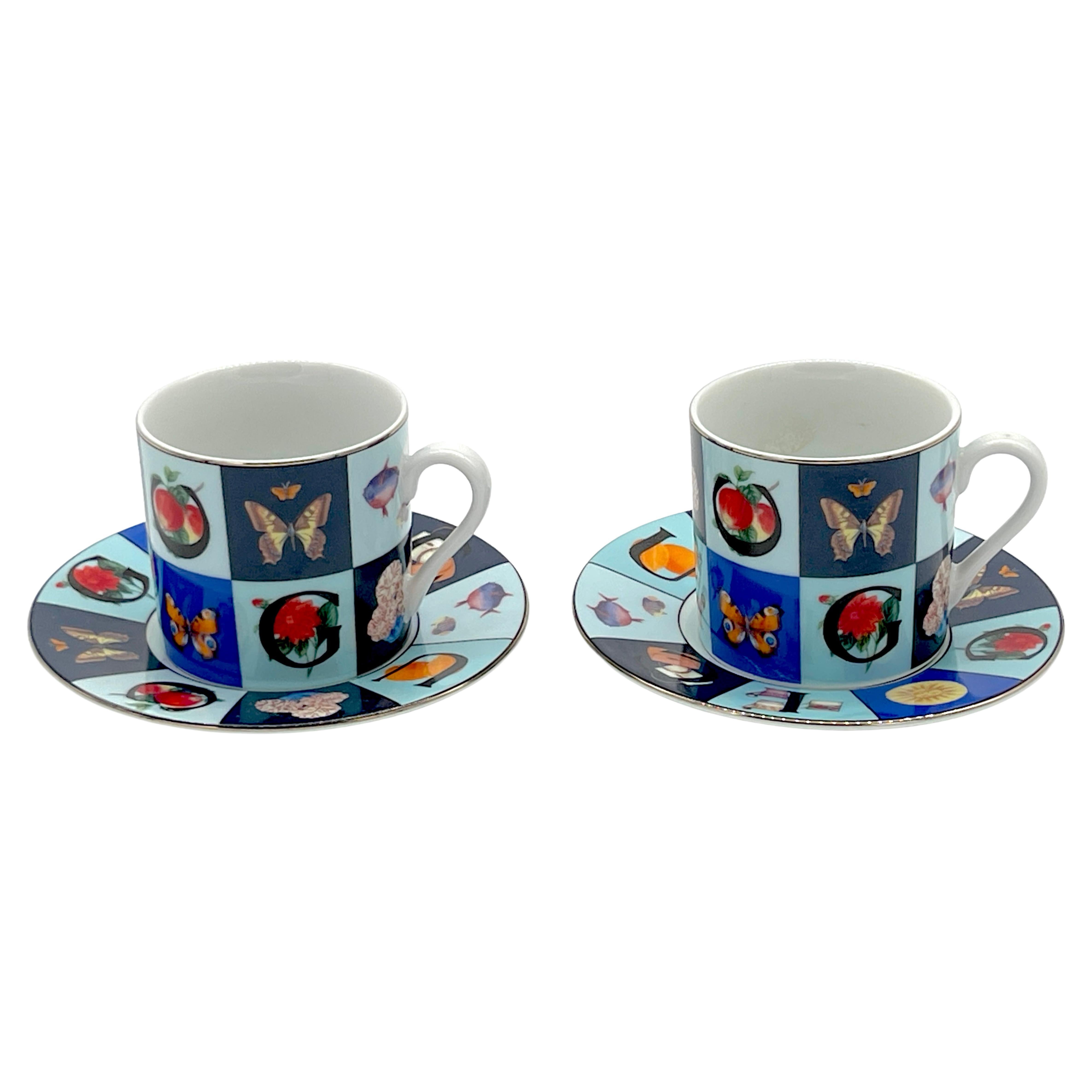 Two Gucci 'Guccissimo' Pattern Demitasse Cups & Saucers 