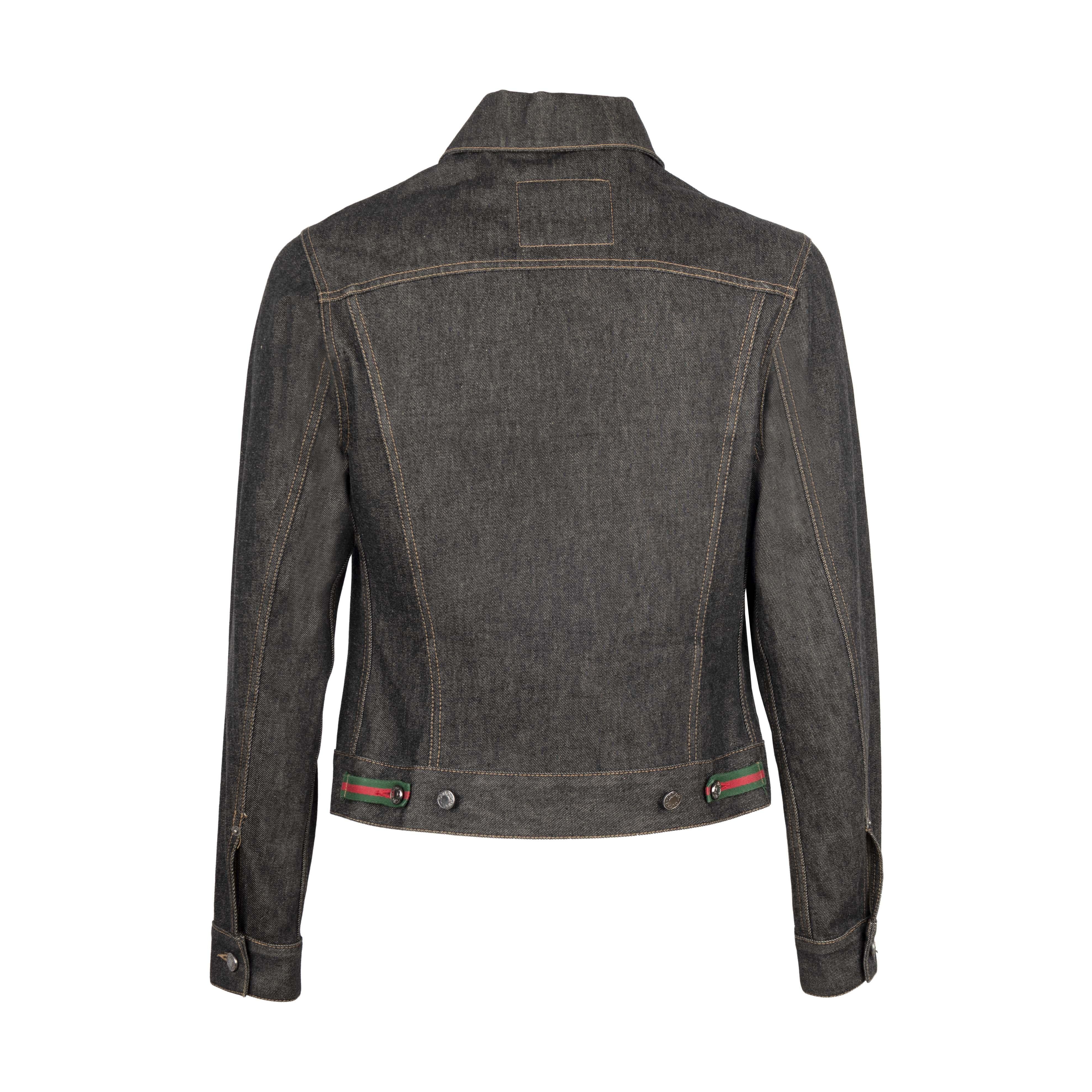 Gucci black denim jacket from the iconic Tom Ford era in the early 2000s, known for revitalizing the brand with his eye-catching ready-to-wear designs. Embellished with the maison's classic red and green details. Long sleeve, button