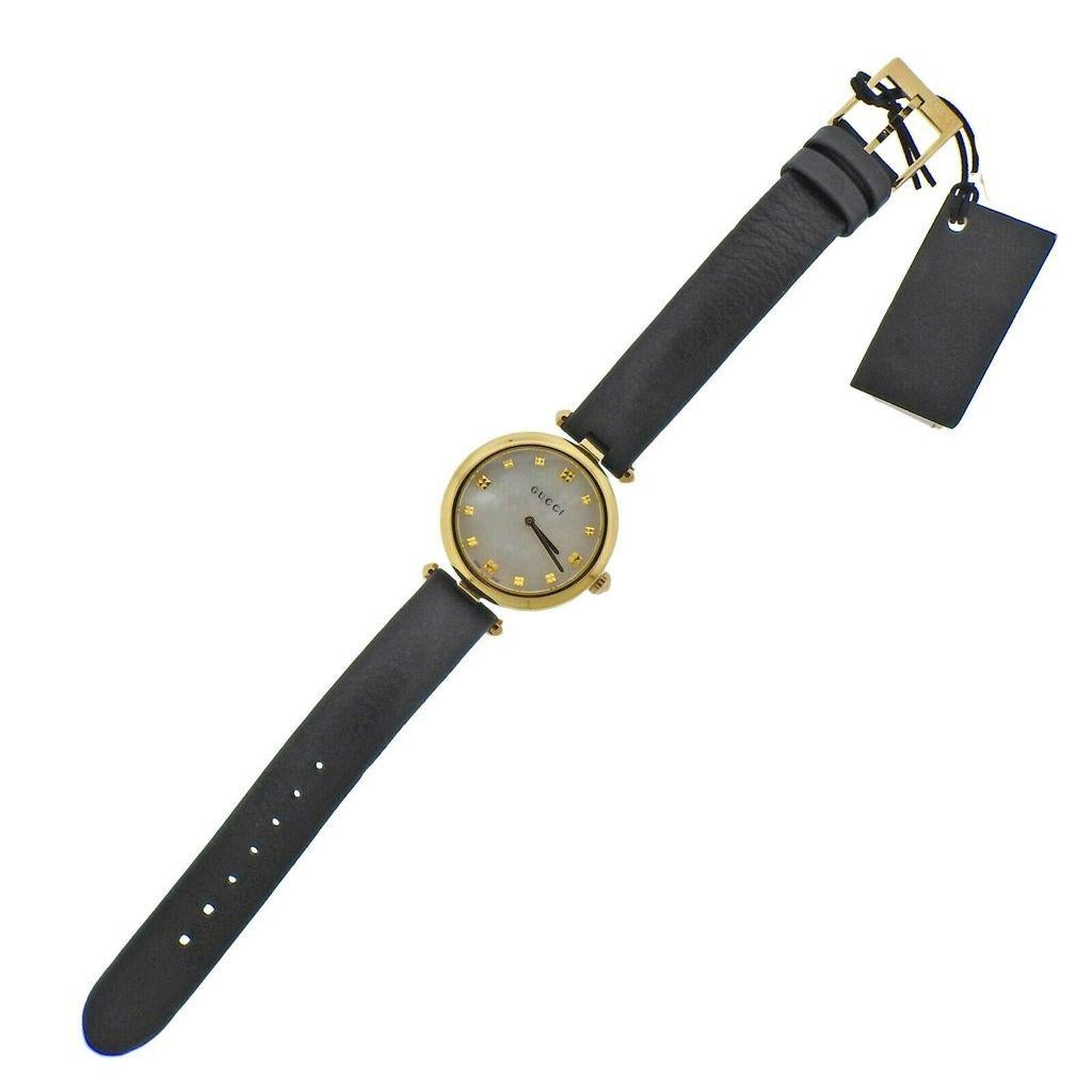  Yellow Gold Tone Stainless Steel quartz ladies watch made by Gucci. Case 32mm. Band - 7.75