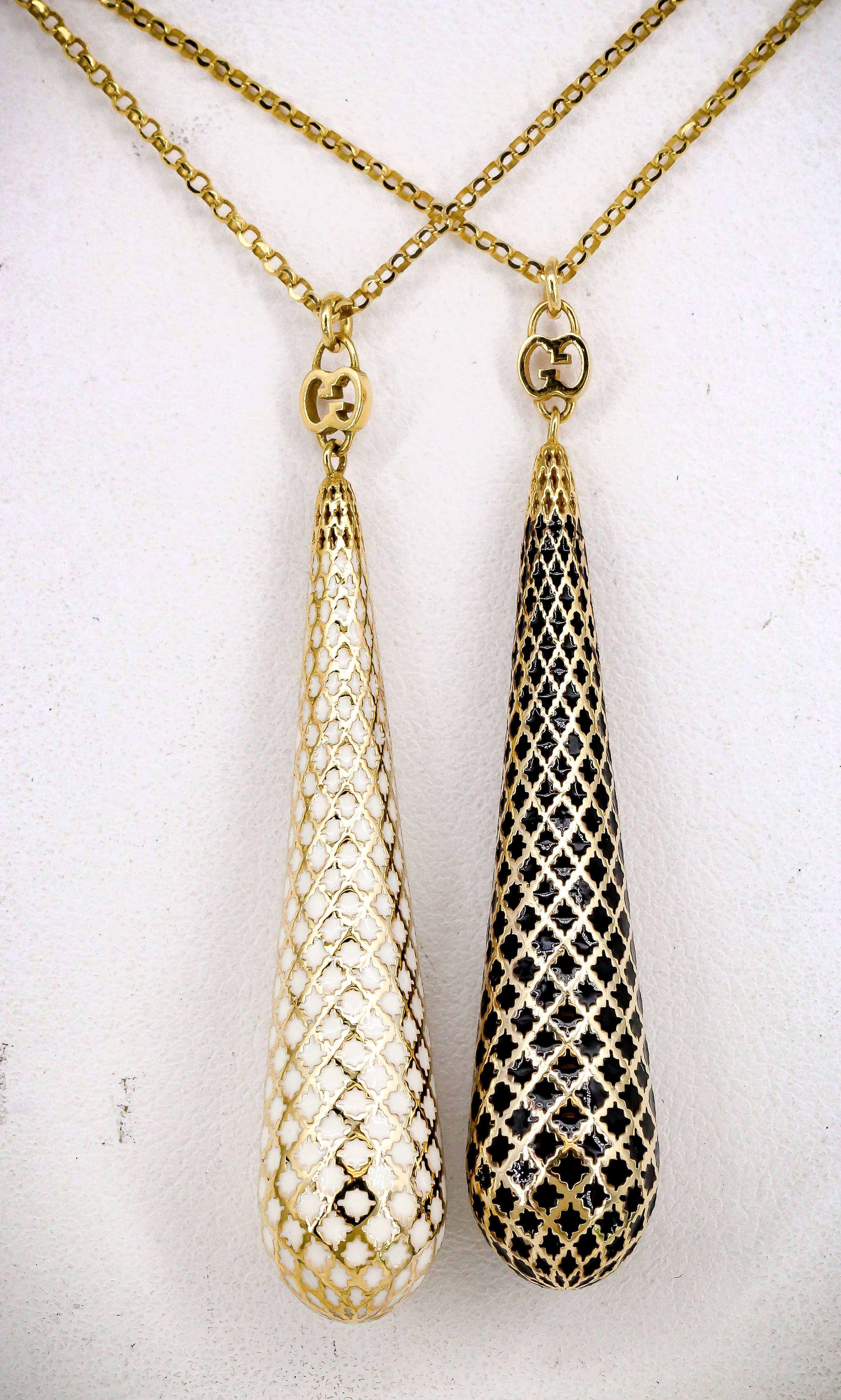 Elegant pair of enamel and gold pendant necklaces from the 