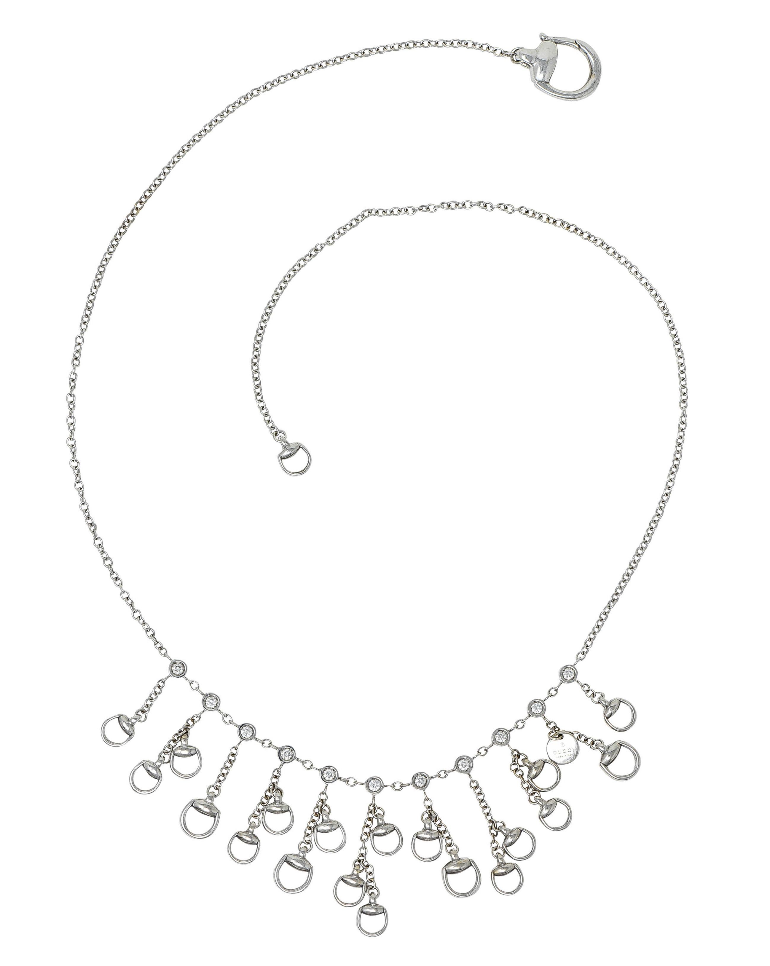 Classic cable chain necklace is bezel set to front by twelve round brilliant cut diamonds

Weighing in total approximately 0.50 carat with G/H color and SI clarity

Suspending articulated fringe drops featuring stylized horsebit motifs and a