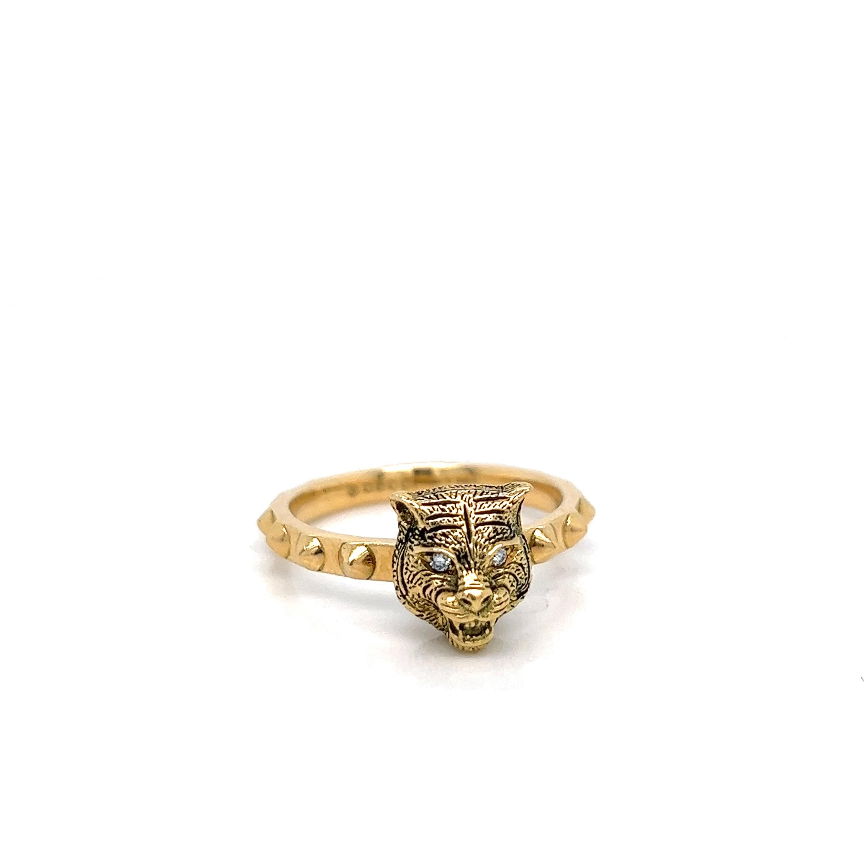 Gucci 18 karat yellow gold band ring; marked Gucci, made in Italy, Au750, 16

Feline motif for the head with eyes of round-cut diamonds of 0.20 carat

Size: 7.5-7.75 
Total weight: 7.3 grams