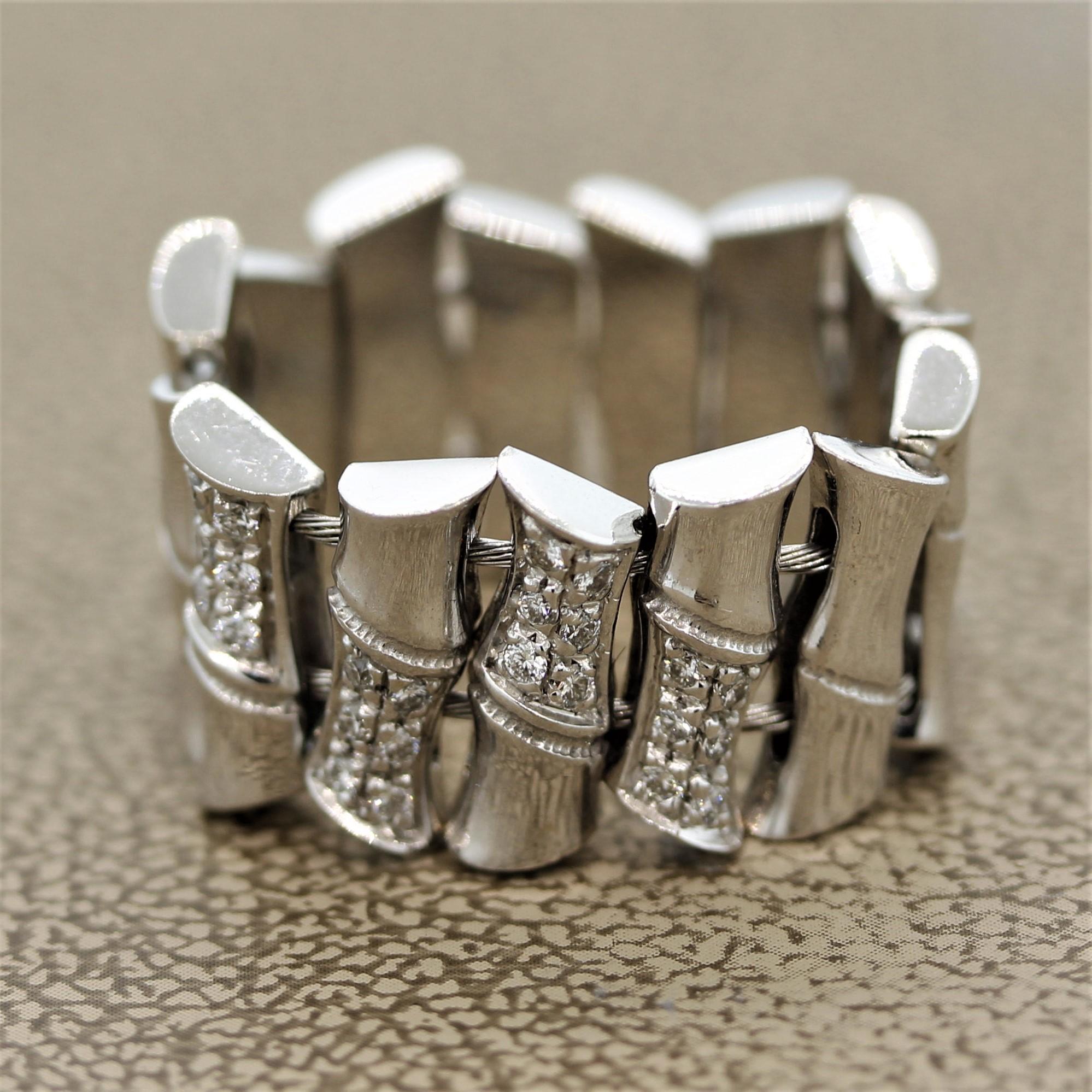 An original piece by Gucci, this ring features 0.24 carats of round brilliant cut diamonds. They are set in 18k white gold bamboo shoots which each move freely from one another. The band has a slight stretch to it allowing it to be worn with