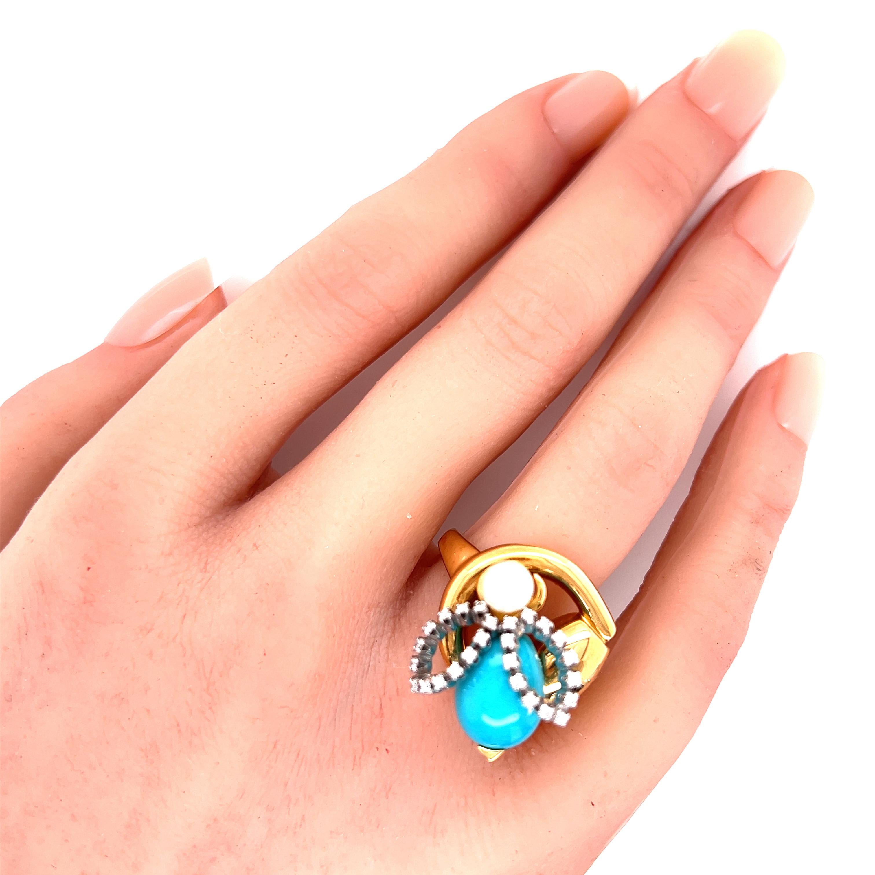 This adorable authentic ring is by Gucci, it is crafted from 18k yellow and white gold featuring a yellow gold horsebit ring with a bee resting on the top, the bee's head is a 5mm pearl with a pear shape turquoise body and white gold wings decorated