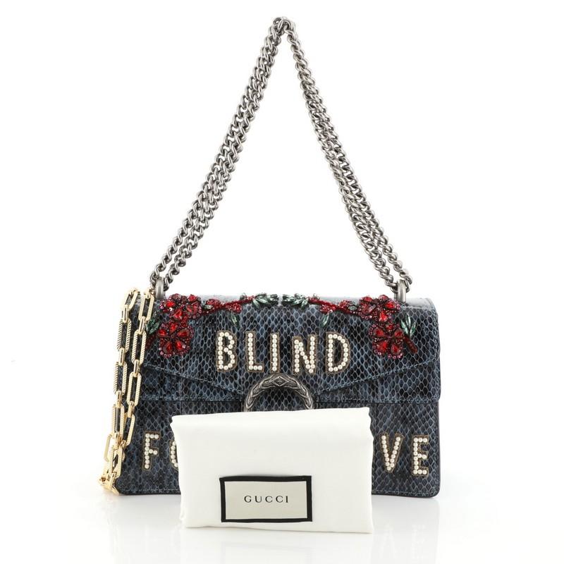 This Gucci Dionysus Bag Embellished Python Small, crafted from genuine blue Python, features chain link strap, textured tiger head spur detail on its flap, accordion-like gusseted side paneling and aged silver and gold-tone hardware. Its hidden