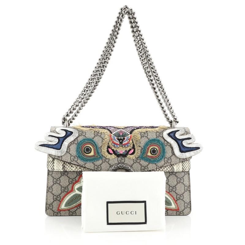 This Gucci Dionysus Bag Embroidered GG Coated Canvas with Python Small, crafted from brown GG coated canvas with genuine python, features chain link strap, multicolored embroidered detailing, and aged silver-tone hardware. Its hidden push-pin