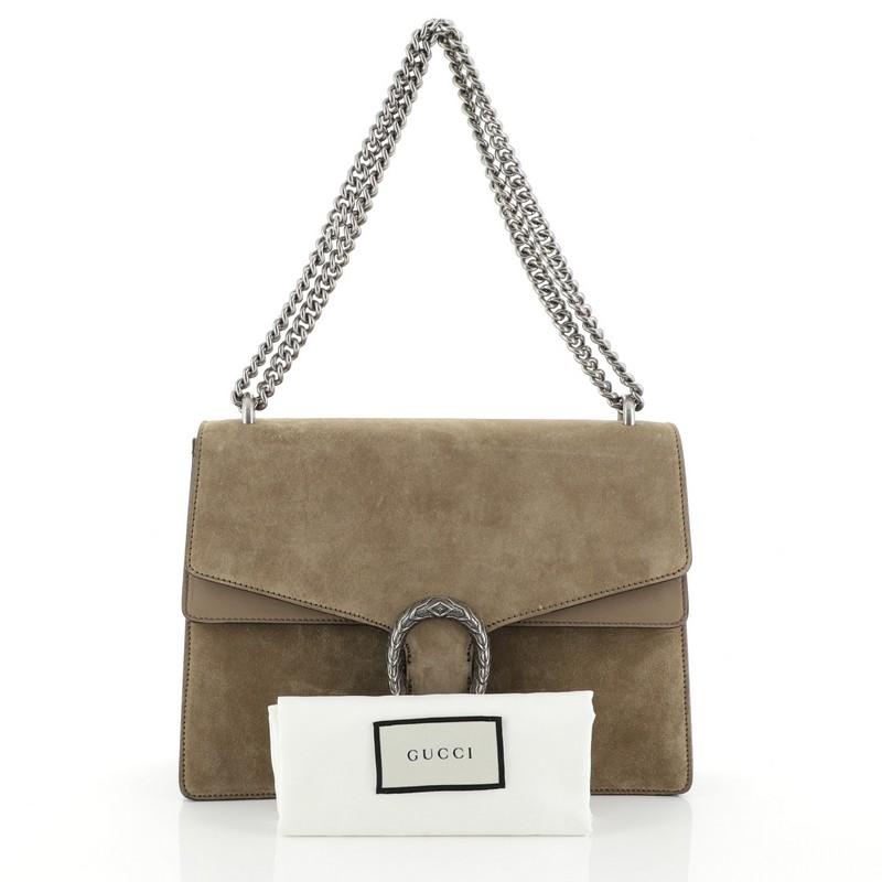 This Gucci Dionysus Bag Suede Medium, crafted from neutral suede, features chain link strap, textured tiger head spur detail on its flap, and aged silver-tone hardware. Its hidden push-pin closure opens to a neutral leather interior divided into two