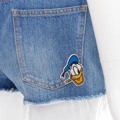 GUCCI Disney Donald Duck blue denim yellow patch cut off shorts 23"
