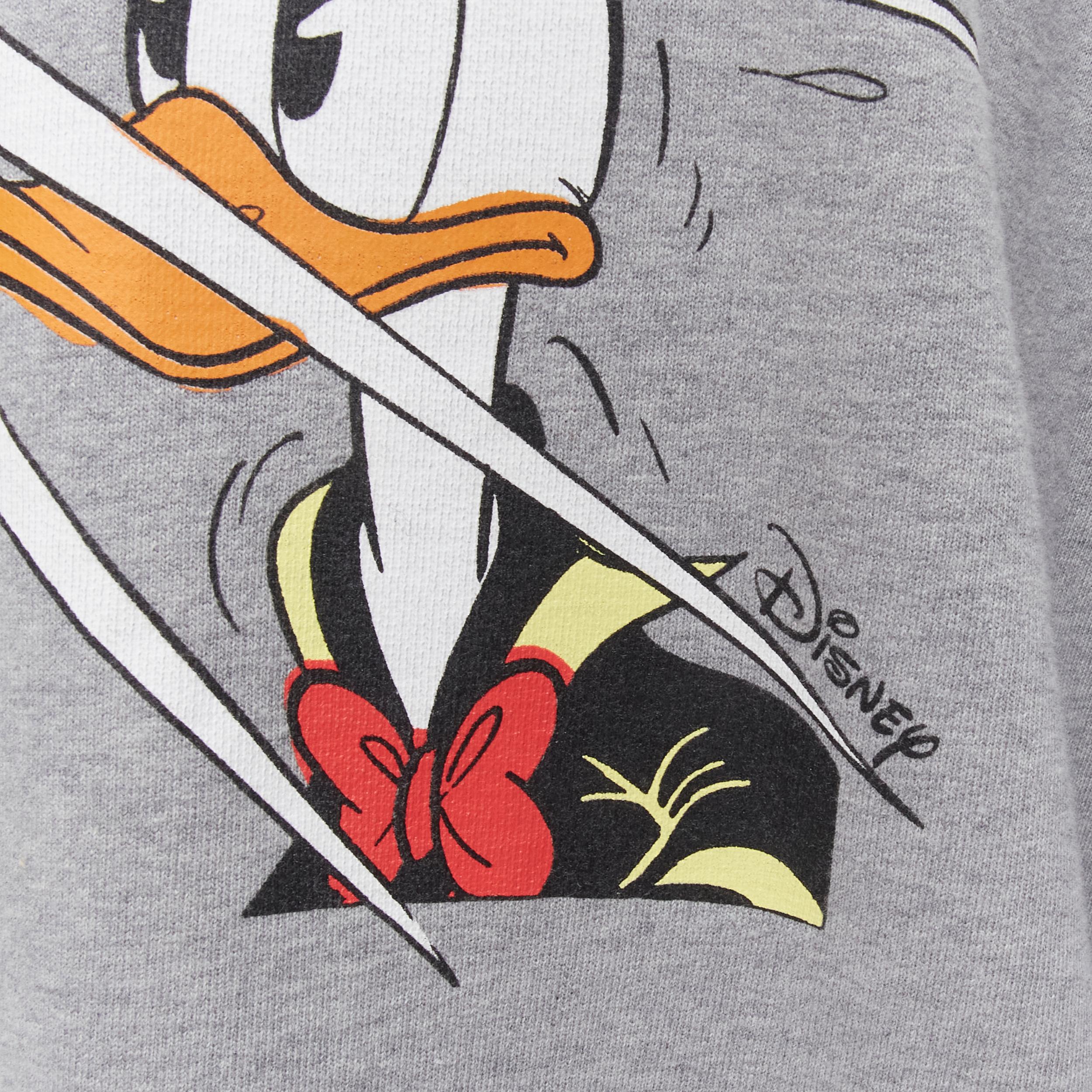GUCCI DISNEY Donald Duck FLASH photography distressed oversized crew sweater L 
Reference: CAWG/A00222 
Brand: Gucci 
Collection: Disney Collaboration 
Material: Cotton 
Color: Grey 
Pattern: Solid 
Extra Detail: Distressed detail along neckline,