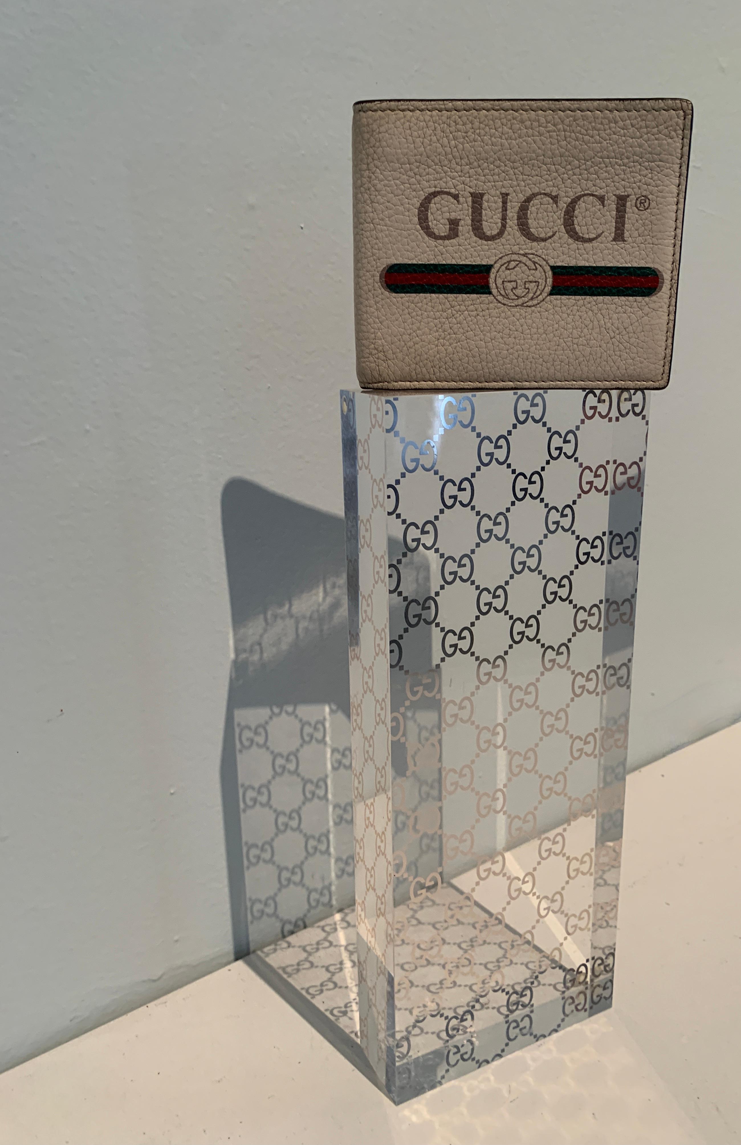 A Gucci piece to display or rest your wallet or other accessories on. The vintage piece with Logo in foil is a great item to add to your valet or dressing area... or in the main room on a coffee table as a sculpture or stand. This is sure to be a